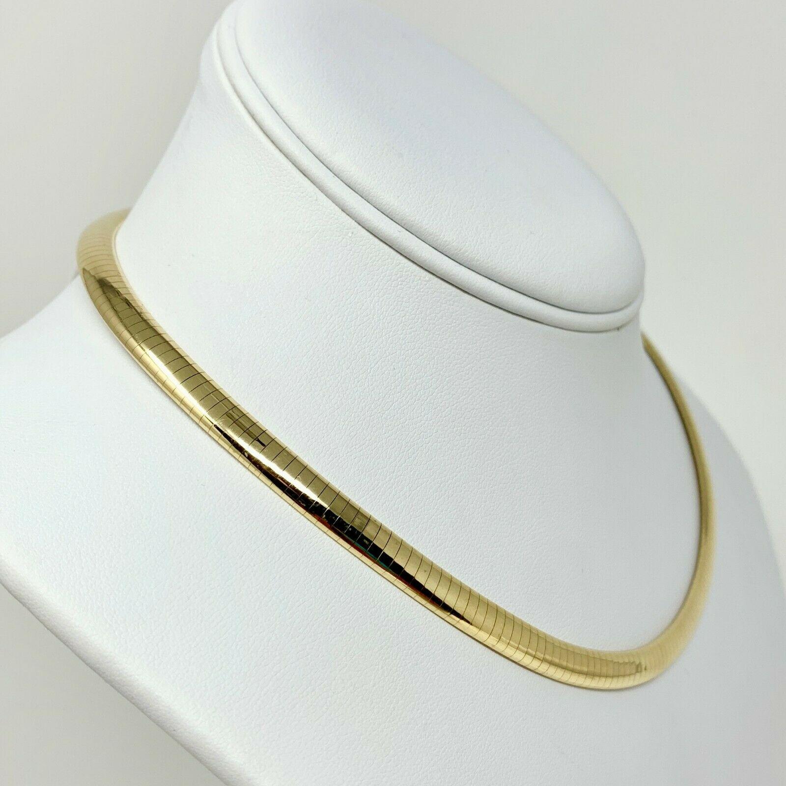 14k Yellow Gold 6mm Choker Collar Omega Link Necklace Italy 16 Inches

Condition:  Excellent (Professionally Cleaned and Polished)
Metal:  14k Gold (Marked, and Professionally Tested)
Weight:  37.3g
Length:  16 Inches
Width:  6mm
Closure:  Tab