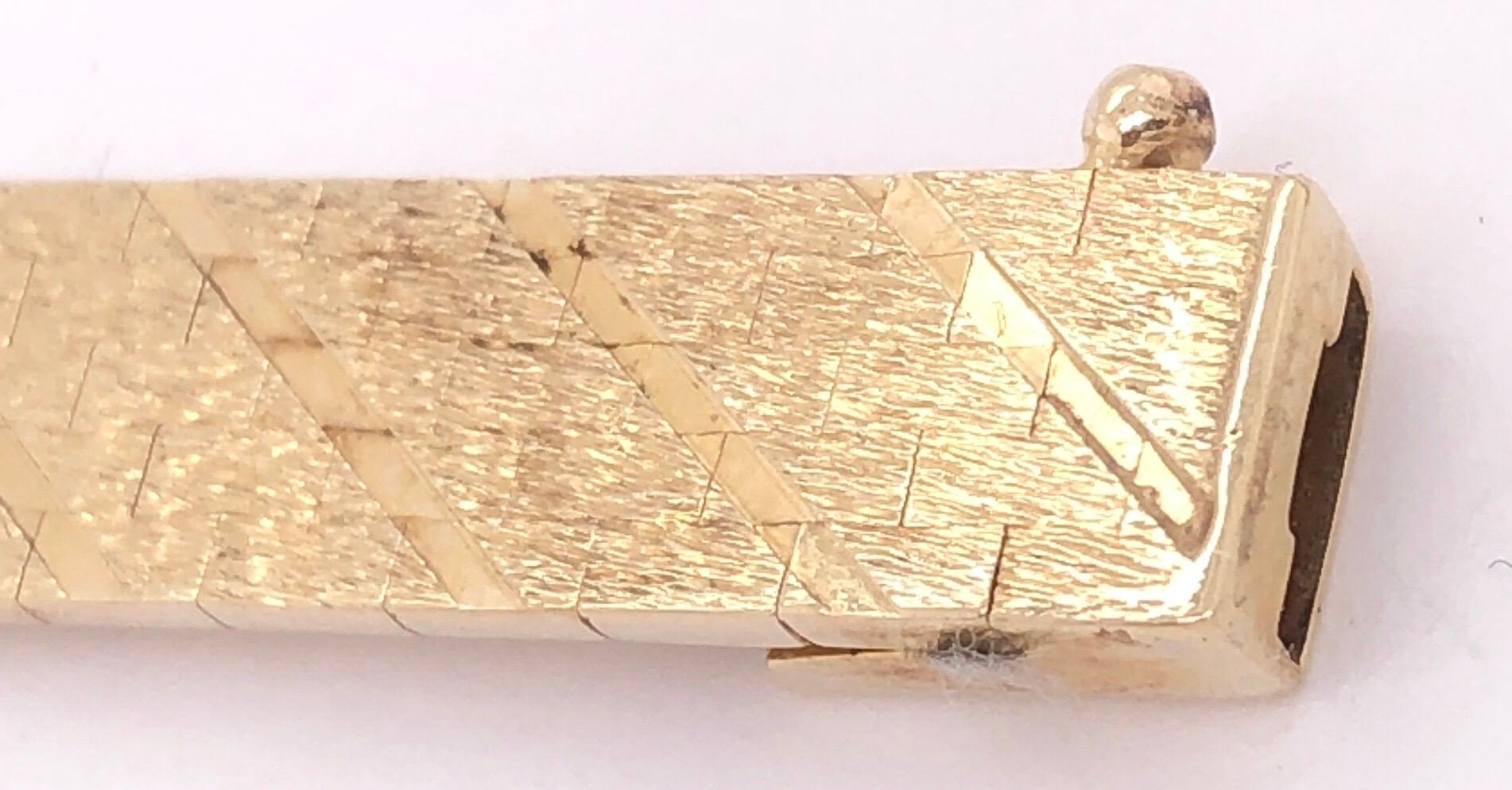 14 Karat Yellow Gold 7 Inch Fancy Link Flat Bracelet.
19 grams total weight. 7.5mm Wide