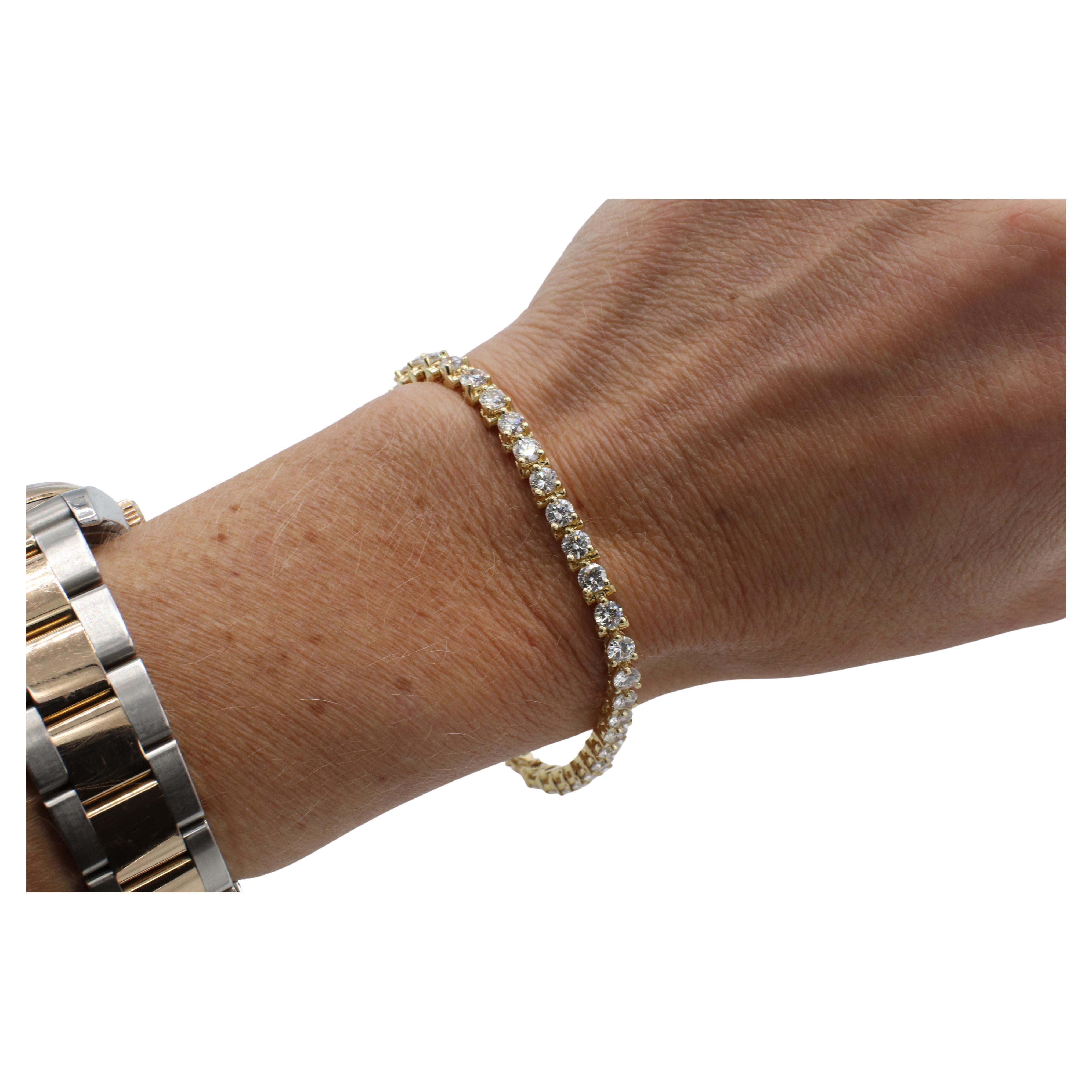 Pulsera Línea Tenis Diamante Natural Redondo Oro Amarillo 14 Kilates 7,20 Quilates 
Metal: oro amarillo de 14 quilates
Peso: 13.64 gramos
Longitud: 7 pulgadas
Anchura: 3.8 mm
Diamantes: Aprox. 7,20 CTW H-I VS-SI
RODD F35000935