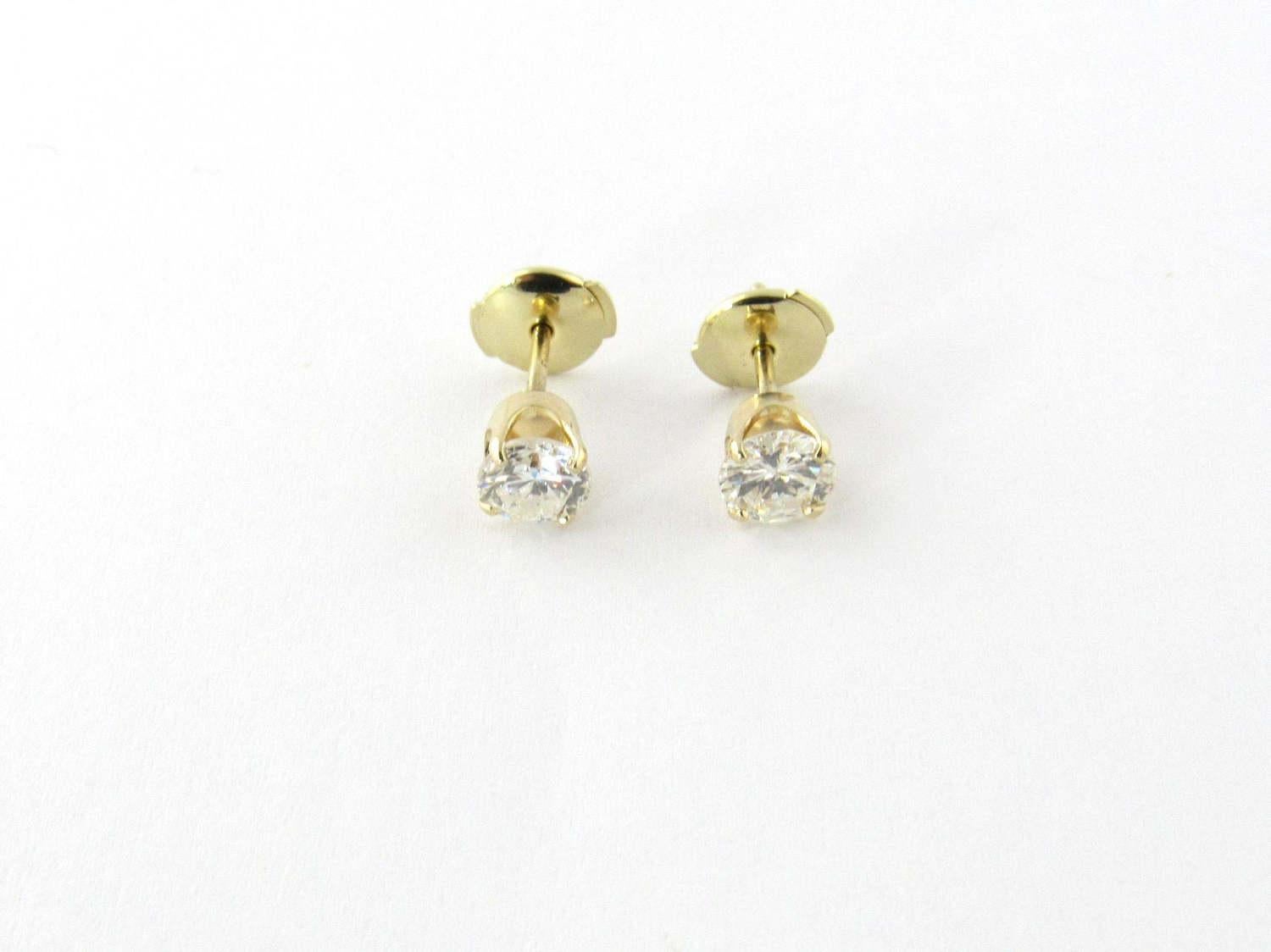 Vintage 14K yellow gold diamond stud earrings. 

Flat disk push backs on 4 prong wire base posts. 

Round brilliant diamonds approx. .95ct twt. H color. SI2 clarity. 

14mm long. 6mm at prongs. 7mm disk diameter backs. 

Total weight: 1.2g, .7dwt