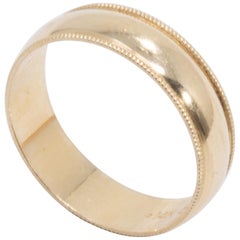 Alianza de boda para hombre con detalles en oro amarillo de 14 quilates