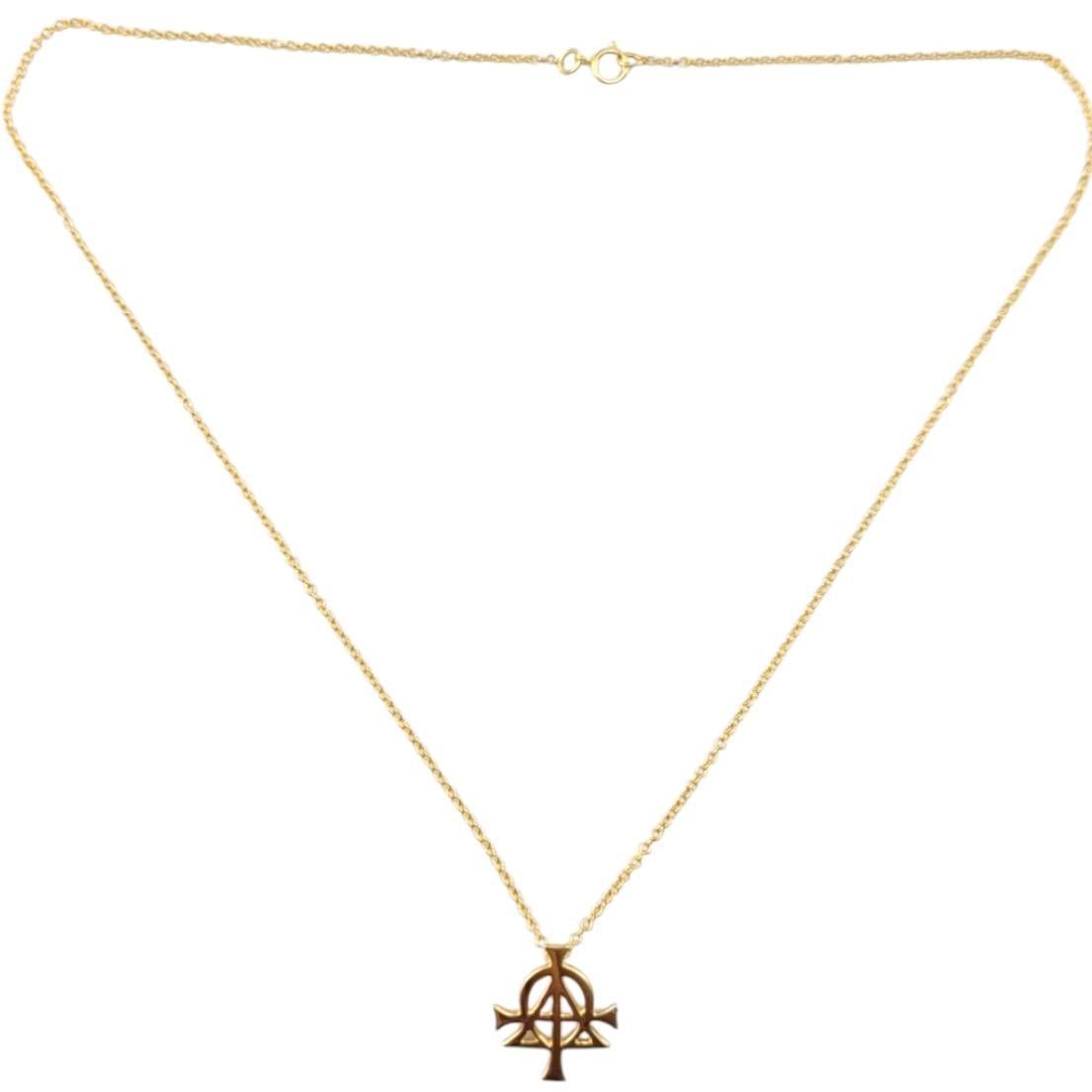 14 Karat Yellow Gold Alpha and Omega Pendant Necklace-

This 14K yellow gold Alpha + Omega pendant necklace features a bold, symbolic design representing the beginning and the end, embodying eternal faith. Crafted with care and stamped with the