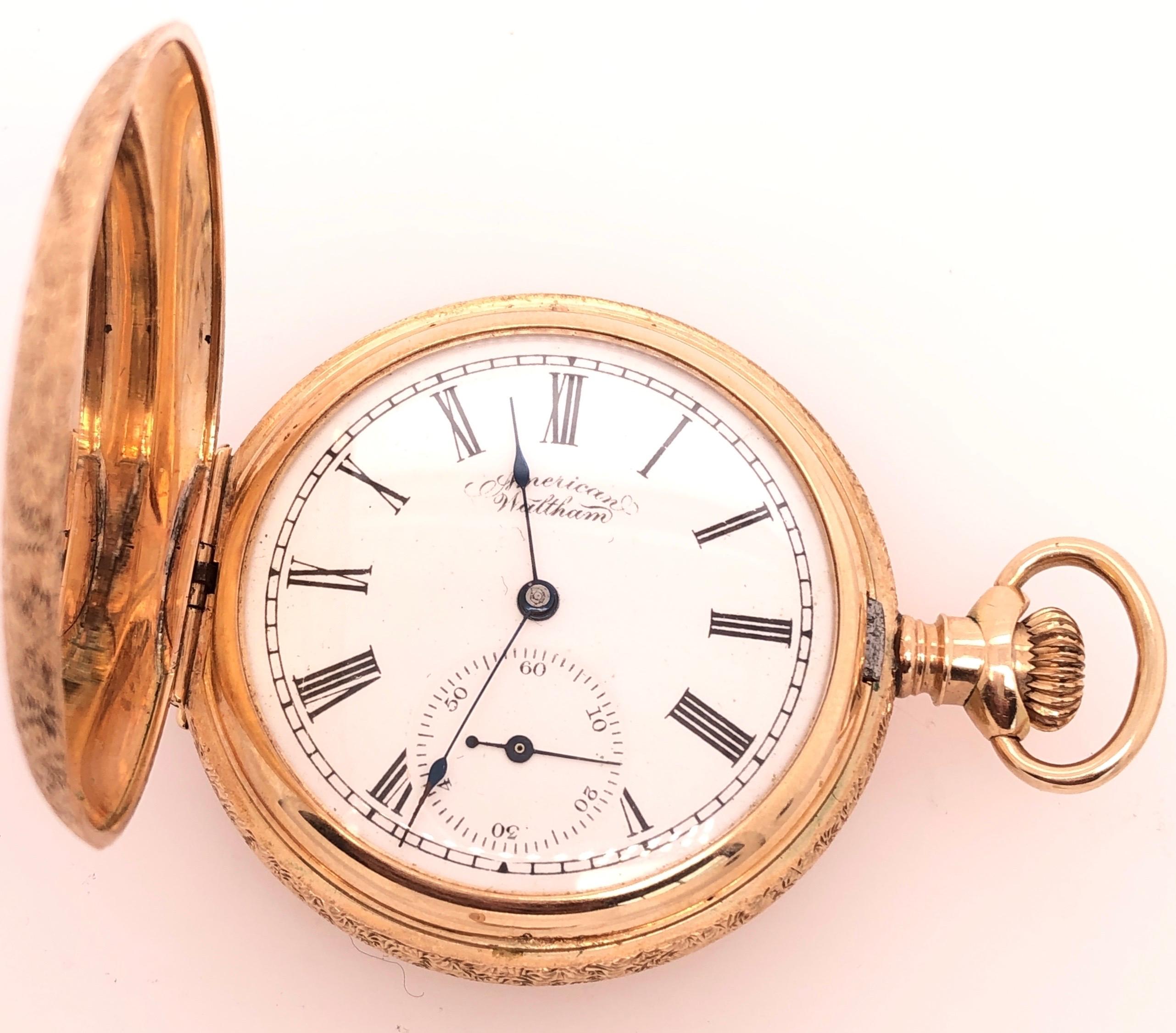  14 Karat Yellow Gold American Waltham Pocket Watch. Serial #133554
Beautiful antique American Waltham pocket watch with white dial having roman numerals including ebony hands and dedicated second dial. Both Sides fully etch decorated. 
40 mm x 40