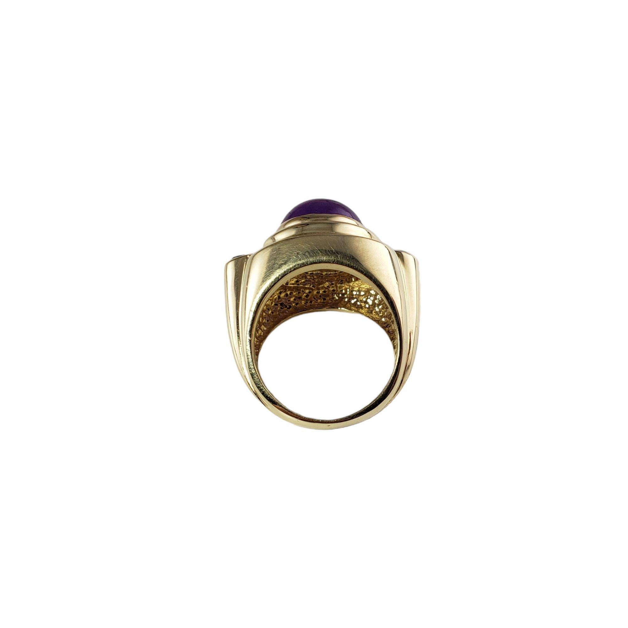 Vintage 14 Karat Yellow Gold Amethyst and Blue Topaz Ring Size 5.5 JAGi Certified-

This stunning ring features one round cabochon cut amethyst (10.6 mm) and two round blue topaz stones set in beautifully detailed 14K yellow gold. Width: 16 mm.