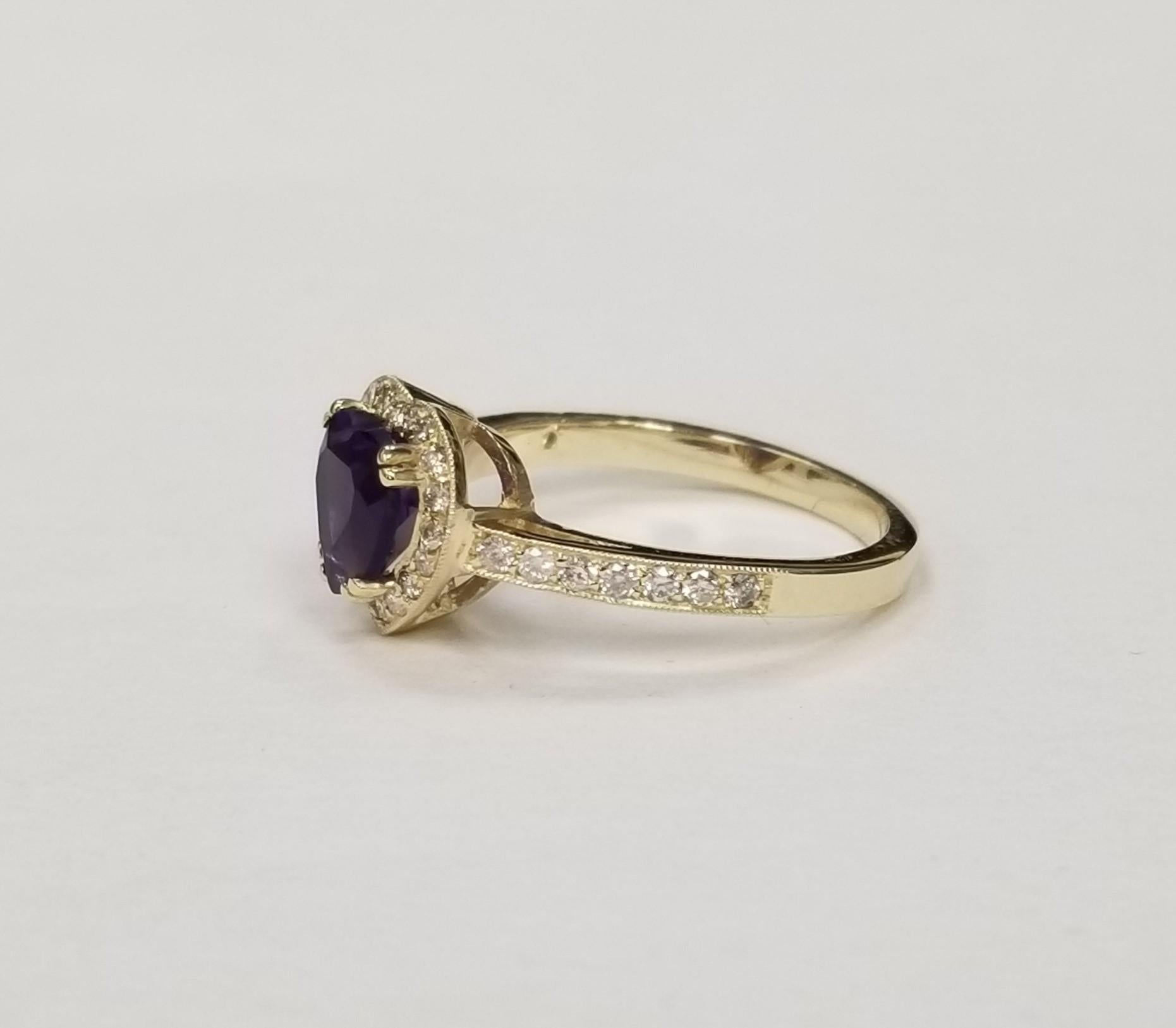 14k yellow gold Amethyst and Diamond Heart halo Ring, containing 1 heart shape cut Amethyst
 of gem quality weighing 1.20cts. and 33 round full cut diamonds of very fine quality weighing .33pts.  This ring is a size 6.75 but we will size to fit for