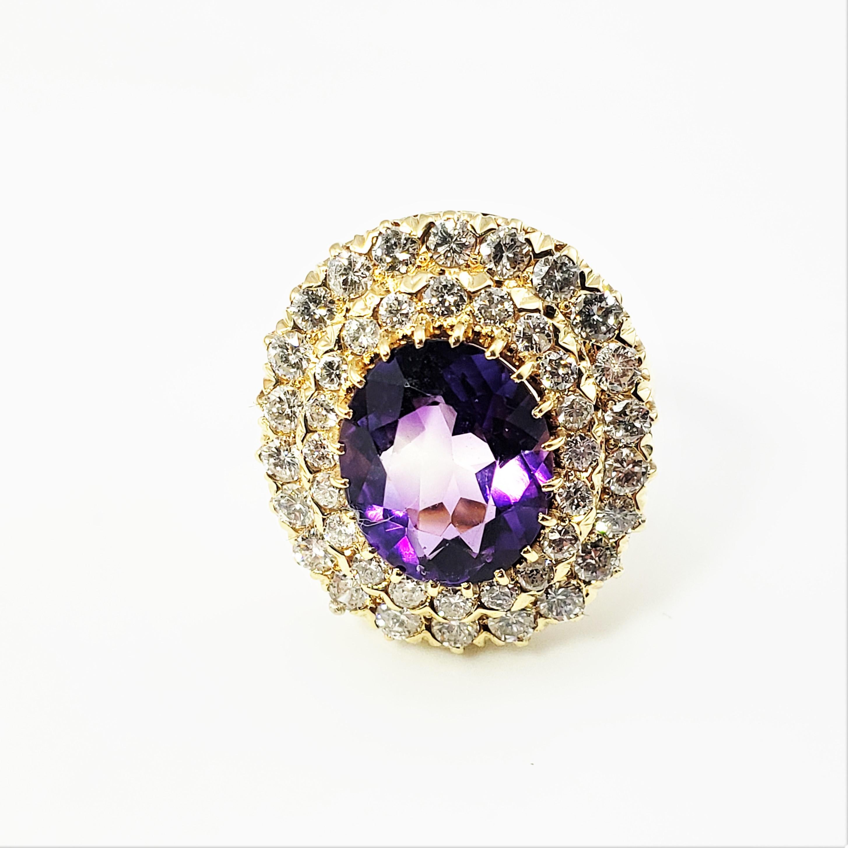 14 Karat Yellow Gold Amethyst and Diamond Ring Size 6.75 GAI Certified-

This stunning ring features one oval amethyst gem (13 mm x 11 mm) surrounded by 42 round brilliant cut diamonds set in classic 14K yellow gold.  Top of ring measures 22 mm x 20