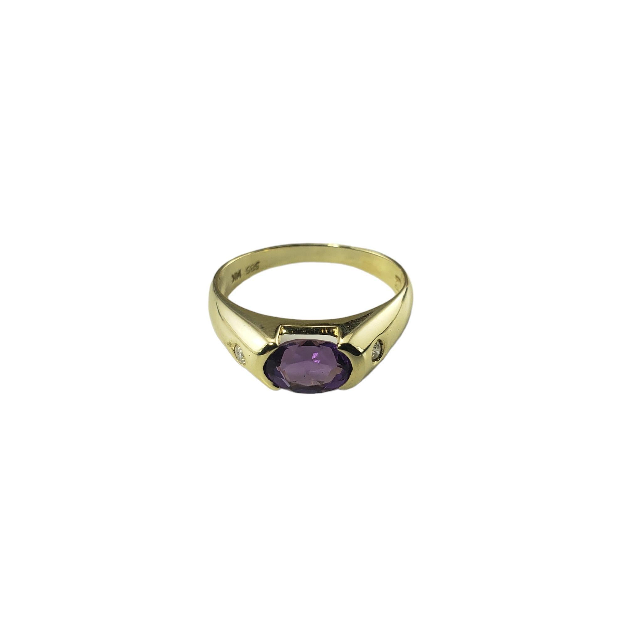 14 Karat Yellow Gold Amethyst and Diamond Ring Size 6-

This lovely ring features one oval amethyst stone (7 mm x 5 mm) and two round brilliant cut diamonds set in classic 14K yellow gold.  Shank: 2.1 mm.

Approximate total diamond weight:   .04