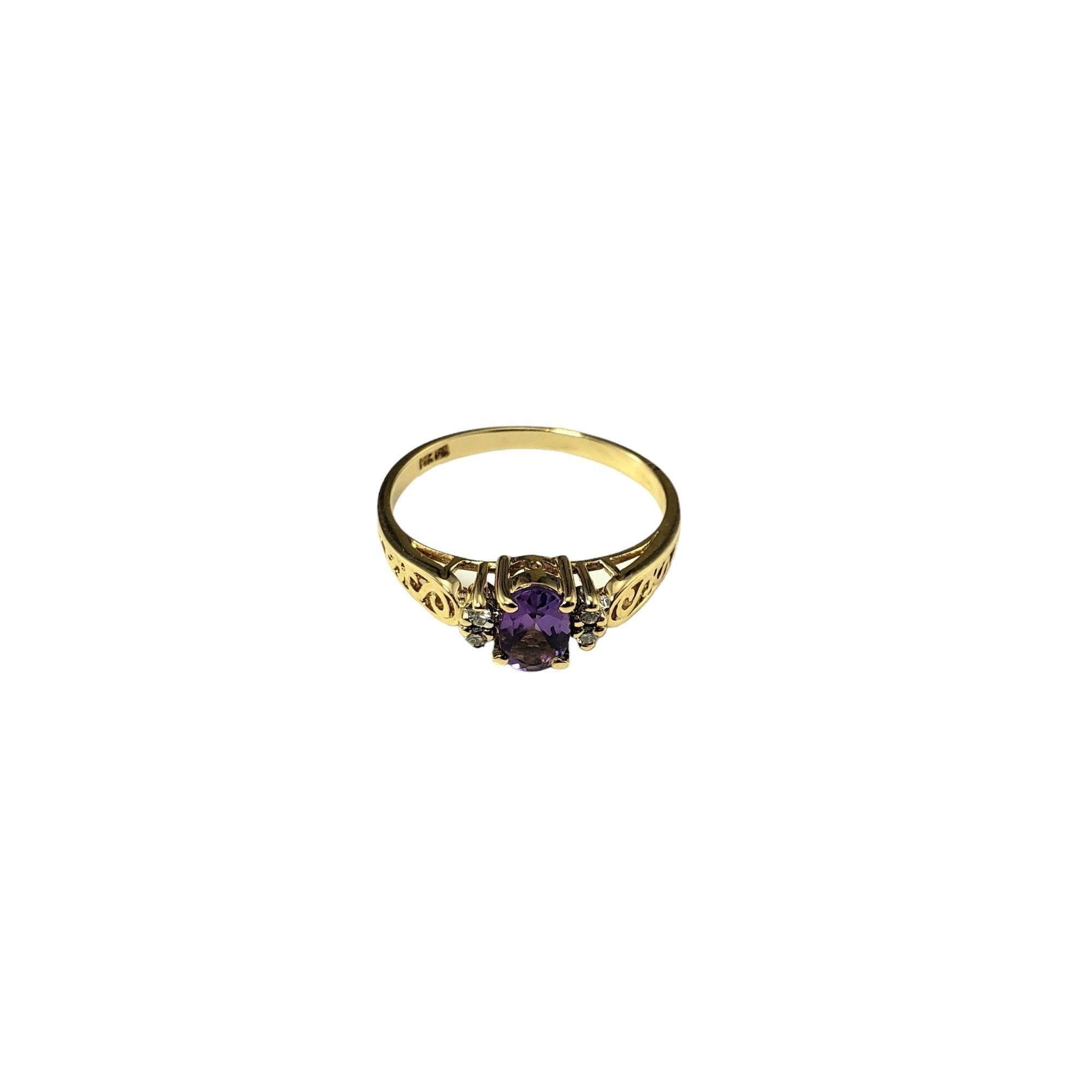 Vintage 14 Karat Yellow Gold Amethyst and Diamond Ring Size 6.5

This elegant ring features one oval amethyst gemstone (6 mm x 4 mm) and four round brilliant cut diamonds set in classic 14K yellow gold.  

Shank: 1.5 mm.

Approximate total diamond