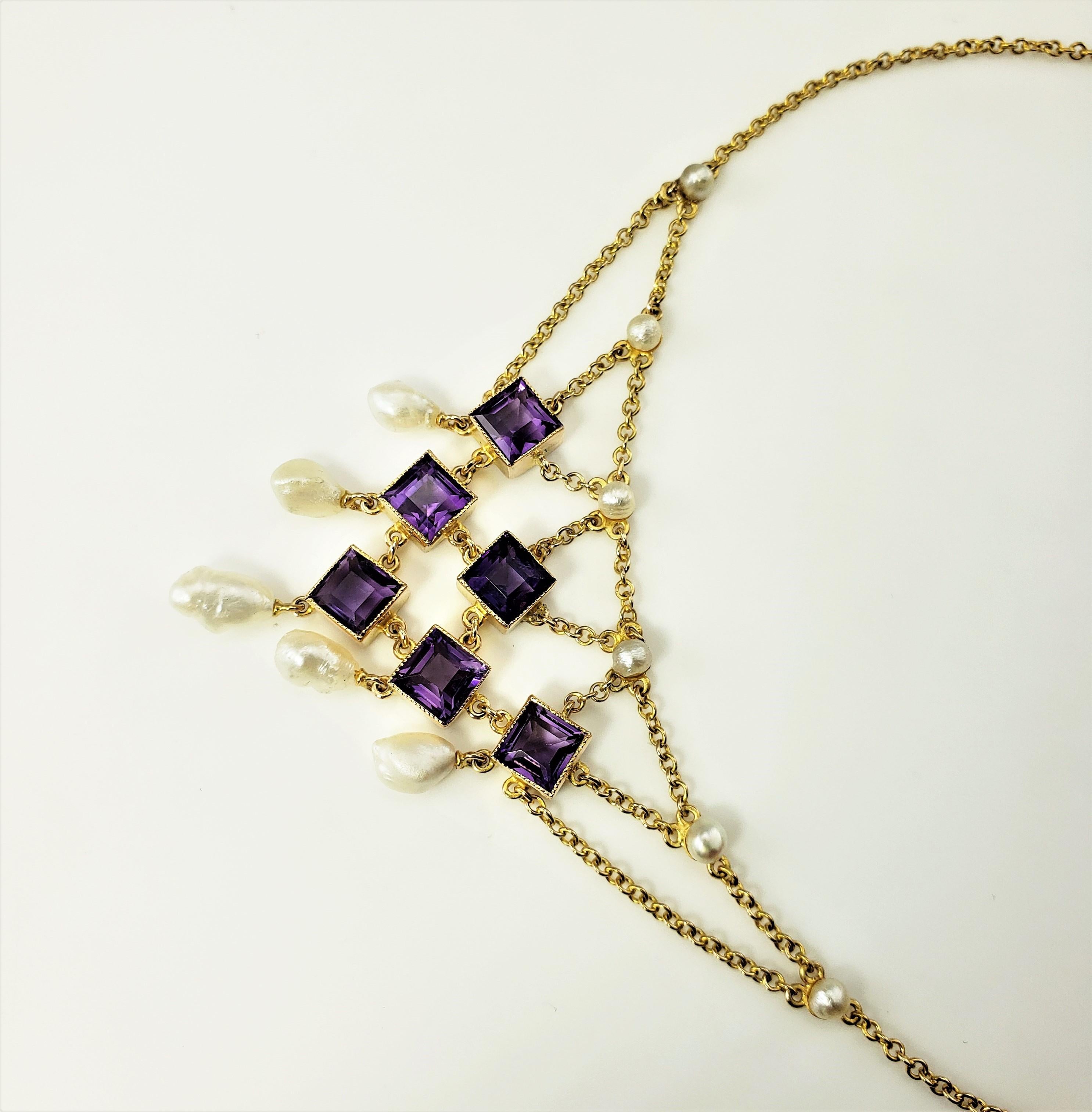14 Karat Yellow Gold Amethyst and Pearl Bib Necklace-

This lovely bib necklace features six square amethyst stones* and 12 pearls set in classic 14K yellow gold.

*Small surface chips noted to edge of two amethyst stone. Not notable to naked