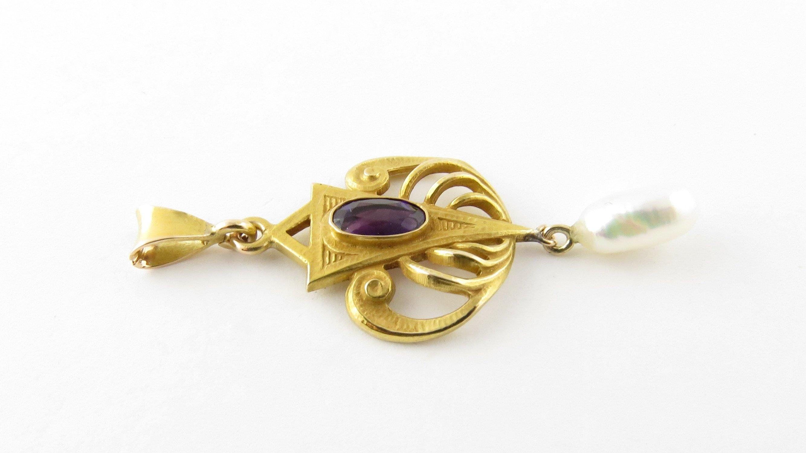 Vintage 14 Karat Yellow Gold, Amethyst and Pearl Pendant- This lovely pendant features one oval amethyst (7 mm x 4 mm) and one freshwater pearl (10 mm x 5 mm) crafted in beautifully detailed 14K gold. Size: 24 mm x 18 mmWeight: 1.7 dwt. / 2.7 gr.