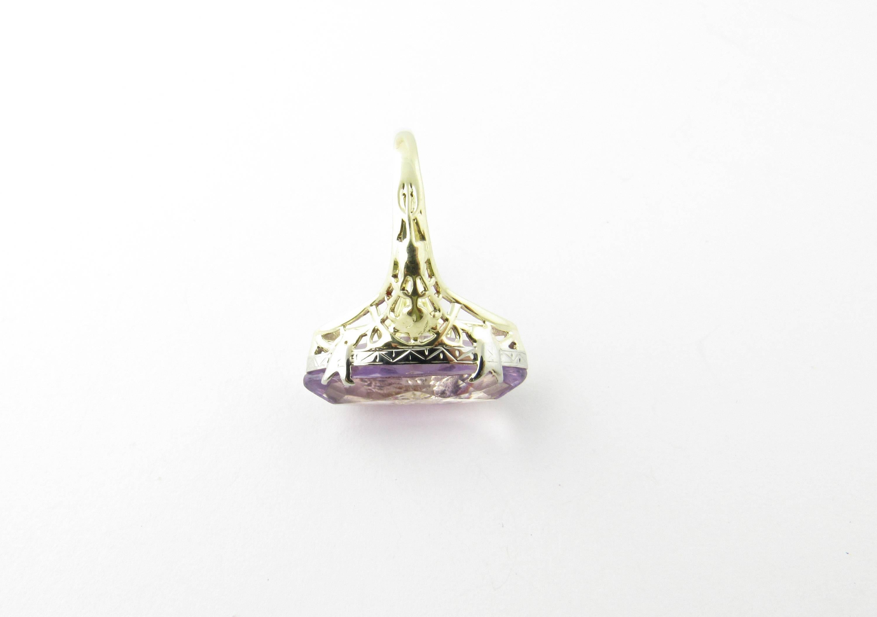 Vintage 14 Karat Yellow Gold Amethyst Ring Size 6.75- 
This lovely ring features a genuine marquis amethyst (20 mm x 10 mm) set in beautifully detailed yellow gold filigree. Some surface scratches on stone not visible to naked eye. Shank measures
