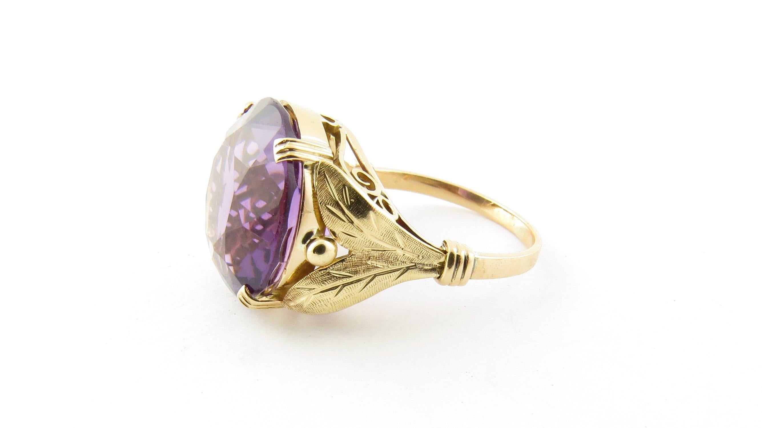 Vintage 14 Karat Yellow Gold Amethyst Ring Size 7.5-This stunning ring features one round amethyst (15 mm) set in meticulously detailed 14K yellow gold. Shank measures 1.5 mm. Ring Size: 7.5 Weight: 4.0 dwt. / 6.3 gr. Acid tested for 14K gold. Very