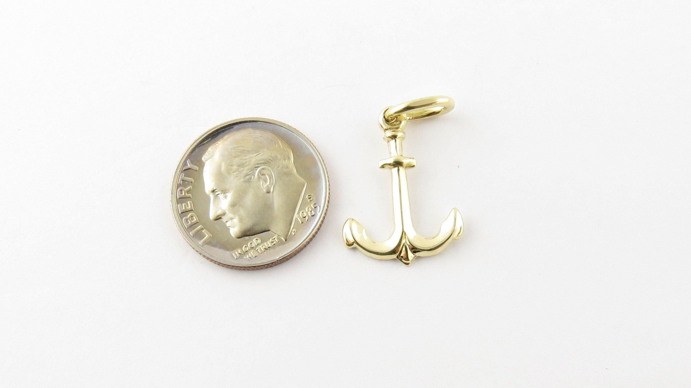 Vintage 14 Karat Yellow Gold Anchor Charm. Anchors Aweigh! This nautical charm features a miniature anchor meticulously detailed in 14K yellow gold.
Size: 18 mm x 14 mm (actual charm) Weight: 0.5 dwt. / 0.9 gr. Stamped: 14K Italy Very good