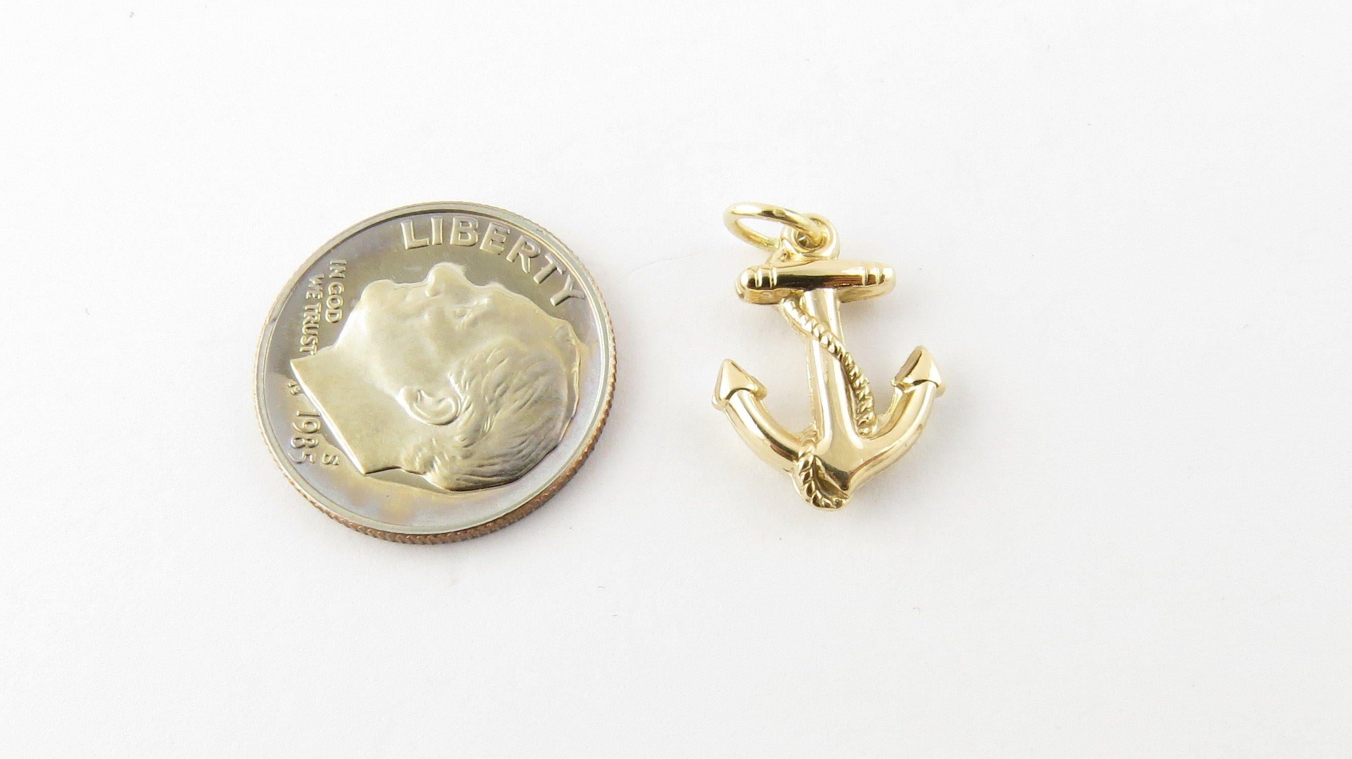 Vintage 14 Karat Yellow Gold Anchor Charm - Anchors Aweigh! This lovely nautical charm features a miniature anchor with rope beautifully detailed in 14K yellow gold.
Size: 16 mm x 12 mm (actual charm) Weight: 0.5 dwt. / 0.8 gr. Stamped: 14K