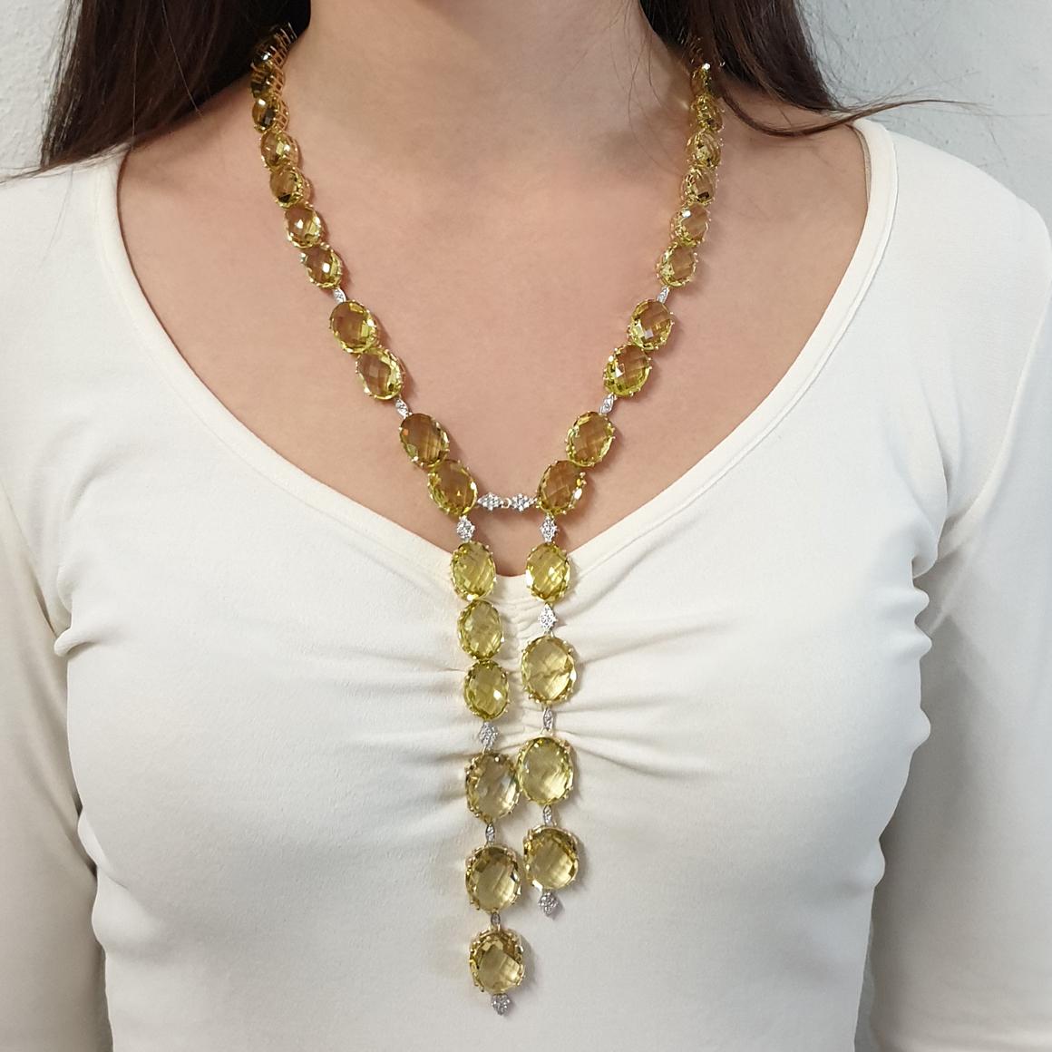 Modern Necklace in 14 karat yellow gold with Lemon Quartz (Oval Briolè cut in 3 differents size: 10x14, 12x16, 15x18 mm) and 18 karat white gold with white diamonds karats 0,92. 
Amazing  Long Necklace inspired by the color of the sun and gives a