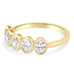 14 Karat Yellow Gold and 5-Stone Bezel Set Oval Cut Diamond Band