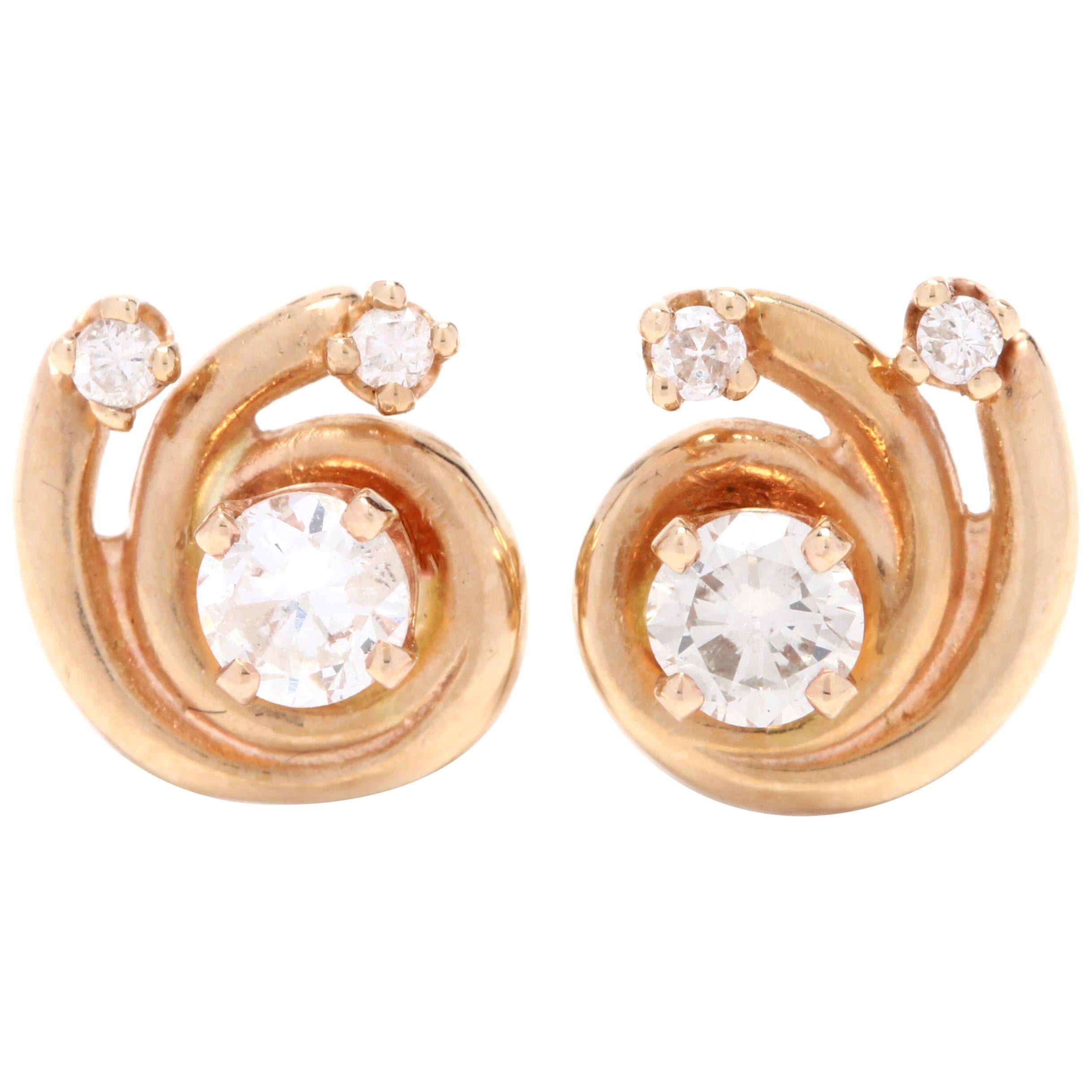 14 Karat Yellow Gold and .56 Carat Diamond Swirl Stud Earrings, April Birthstone