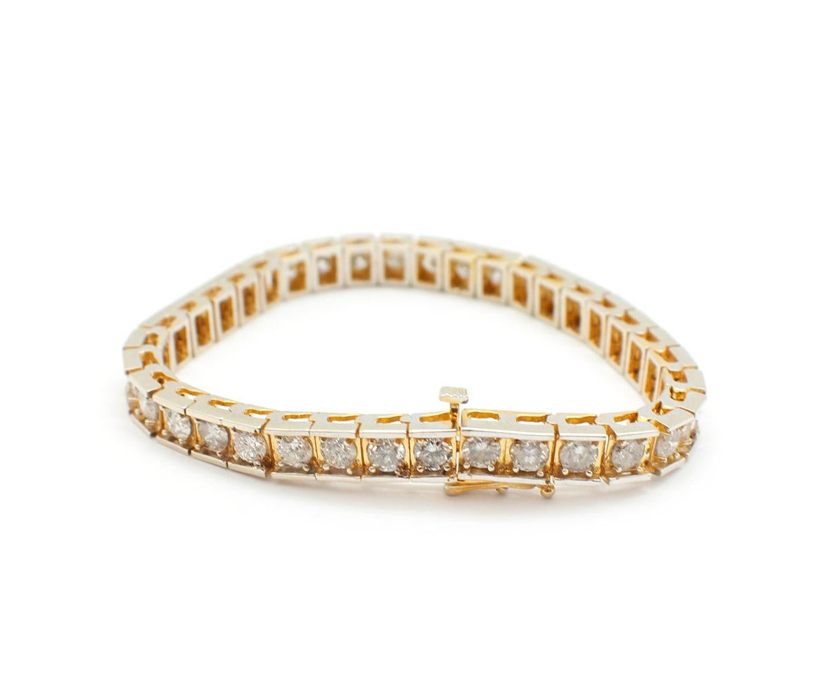 Modern 14 Karat Yellow Gold and 7.70 Carat Diamond Tennis Bracelet