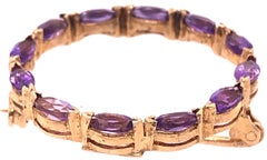 14 Karat Yellow Gold and Amethyst Circle Brooch