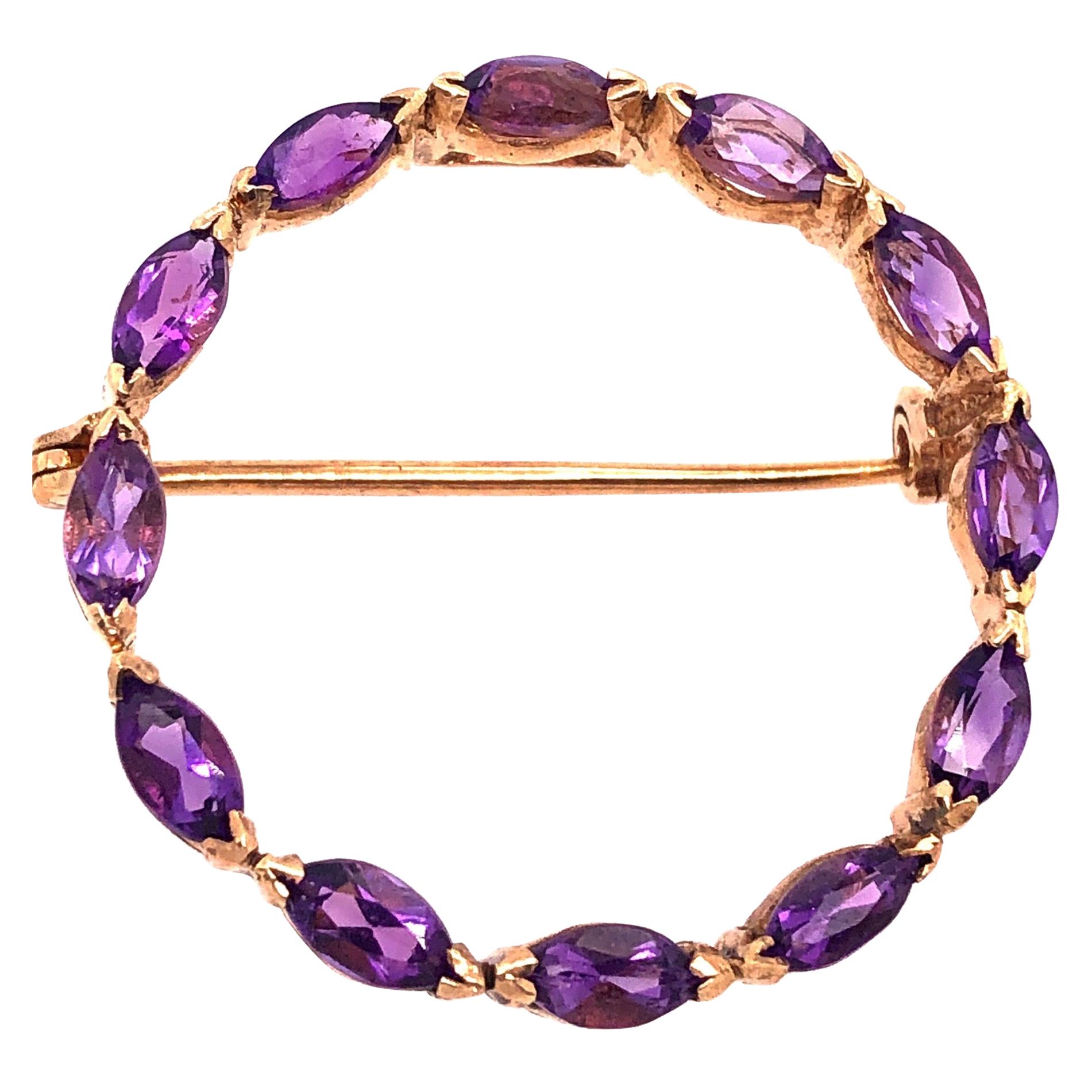 14 Karat Yellow Gold and Amethyst Circle Brooch For Sale