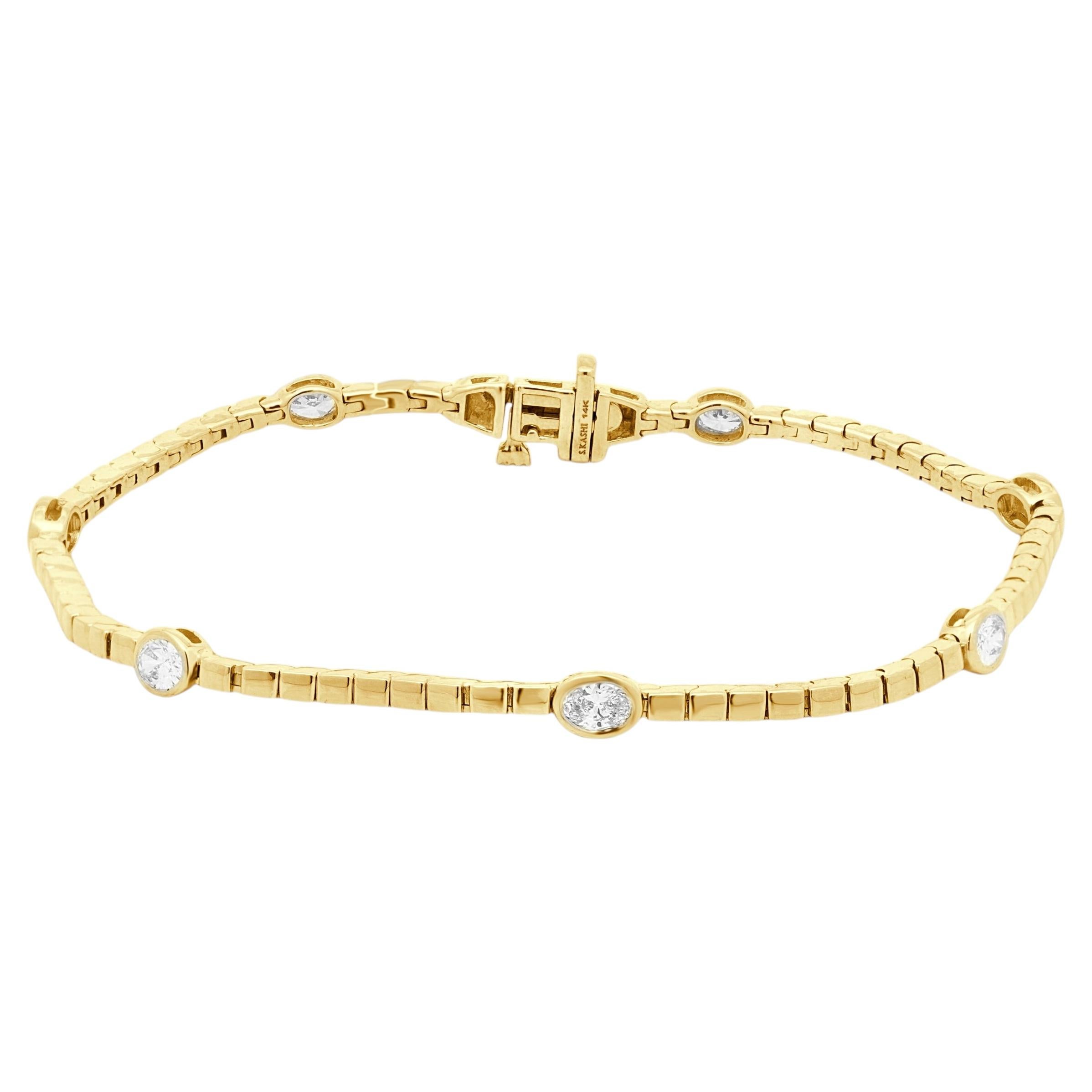 Pulsera de oro amarillo de 14 quilates y diamantes talla oval engastados en bisel