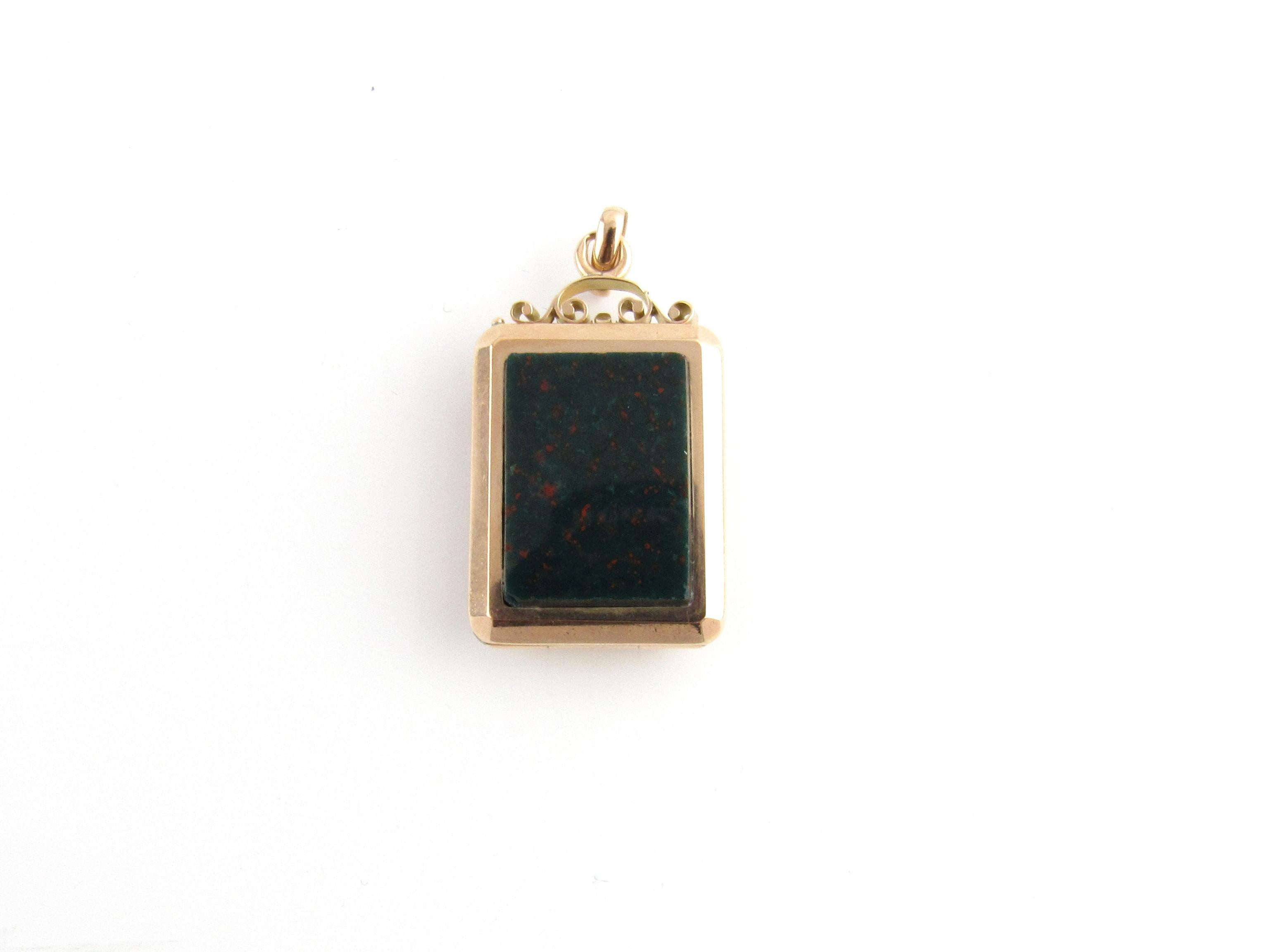 Vintage 14 Karat Yellow Gold and Bloodstone Locket

This elegant hinged locket features two bloodstone stones (21 mm x 16 mm) set in beautifully detailed 14K yellow gold.

Size: 35 mm x 21 mm

Weight: 7.3 dwt. / 11.5 gr.

Acid tested for 14K
