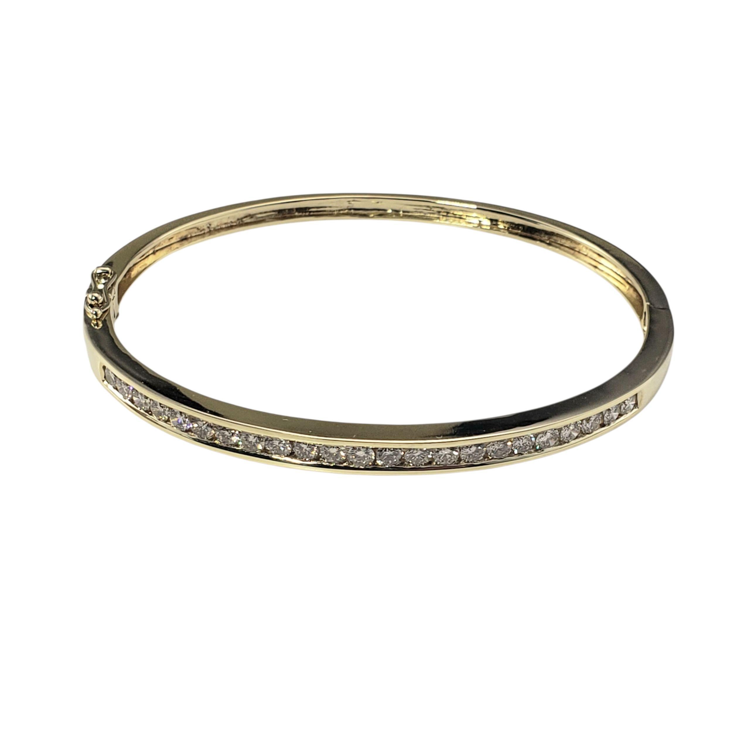 14K Yellow Gold and Champagne Diamond Bangle Bracelet-

Understated luxury meets timeless elegance in this stunning 14K yellow gold hinged bracelet featuring 23 round brilliant cut champagne diamonds, channel-set in a seamless line of warm sparkle.