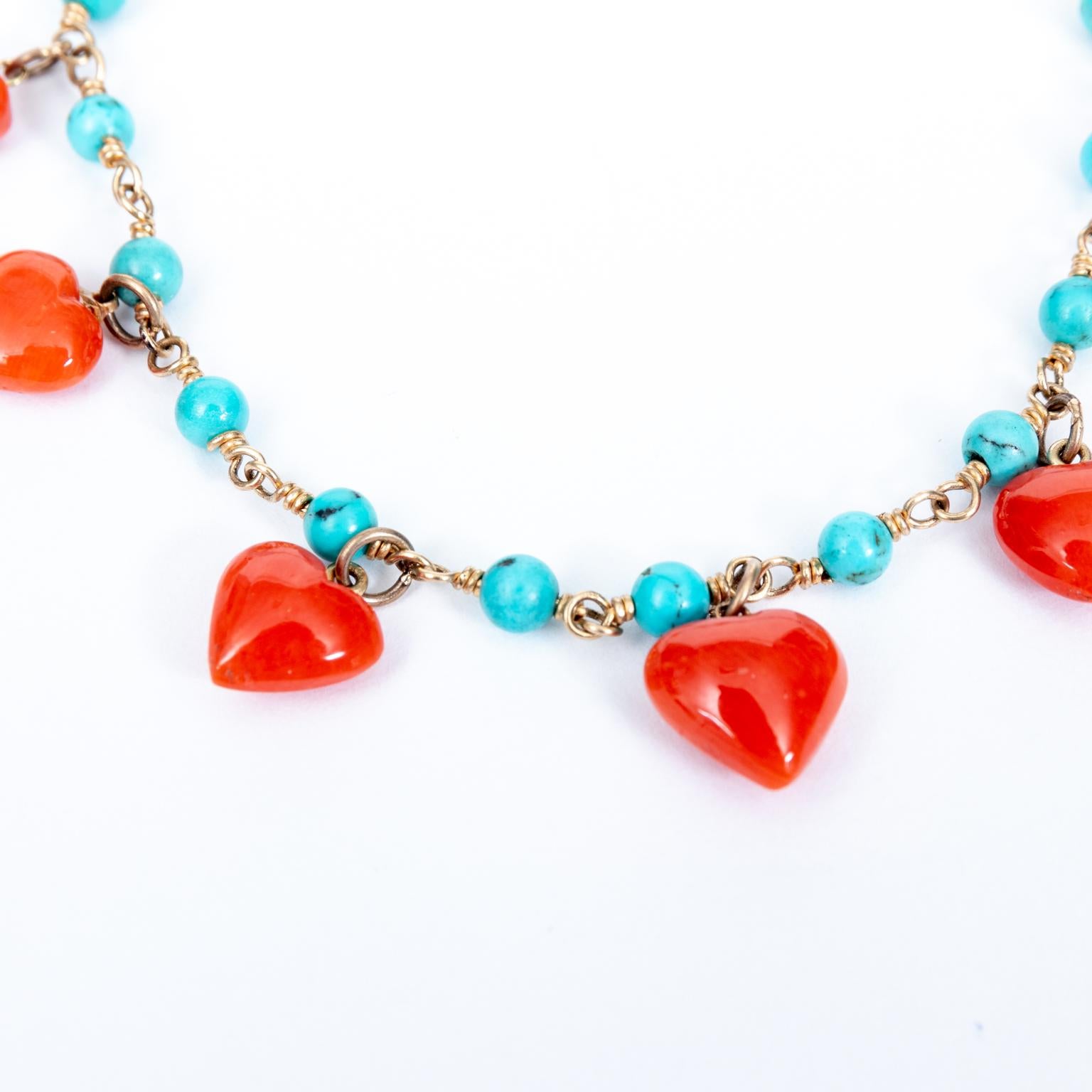Contemporary 14 Karat Yellow Gold and Coral Heart Charm Bracelet For Sale