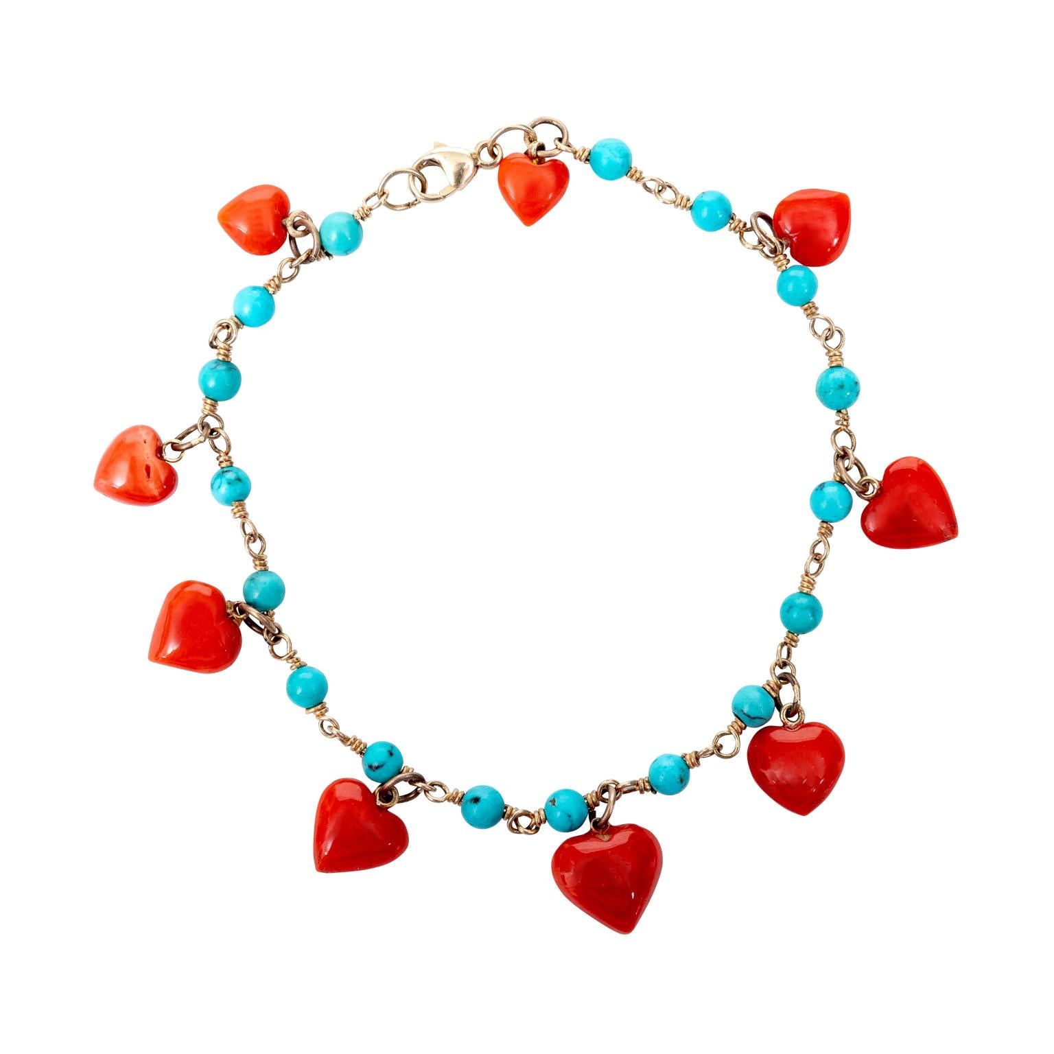 14 Karat Yellow Gold and Coral Heart Charm Bracelet For Sale