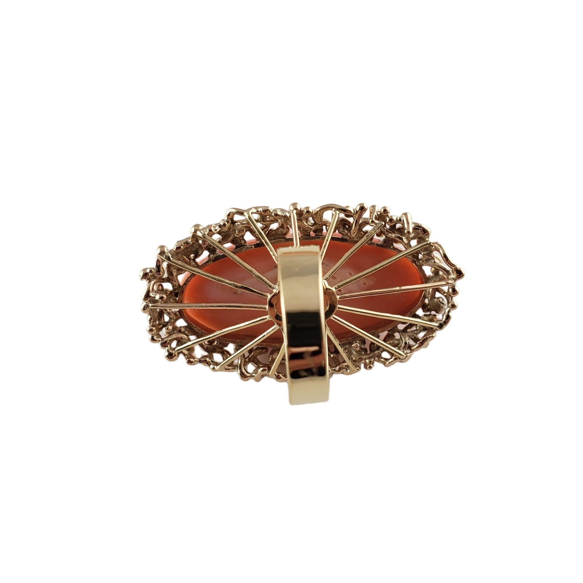Vintage 14 Karat Yellow Gold and Cabochon Coral Ring Size 7.5 JAGi Certified-

This lovely ring features one oval cabochon coral stone (37 mm x 17 mm) set in beautifully detailed 14K yellow gold.
Top of ring measures 45 mm x 25 mm. Shank: 4