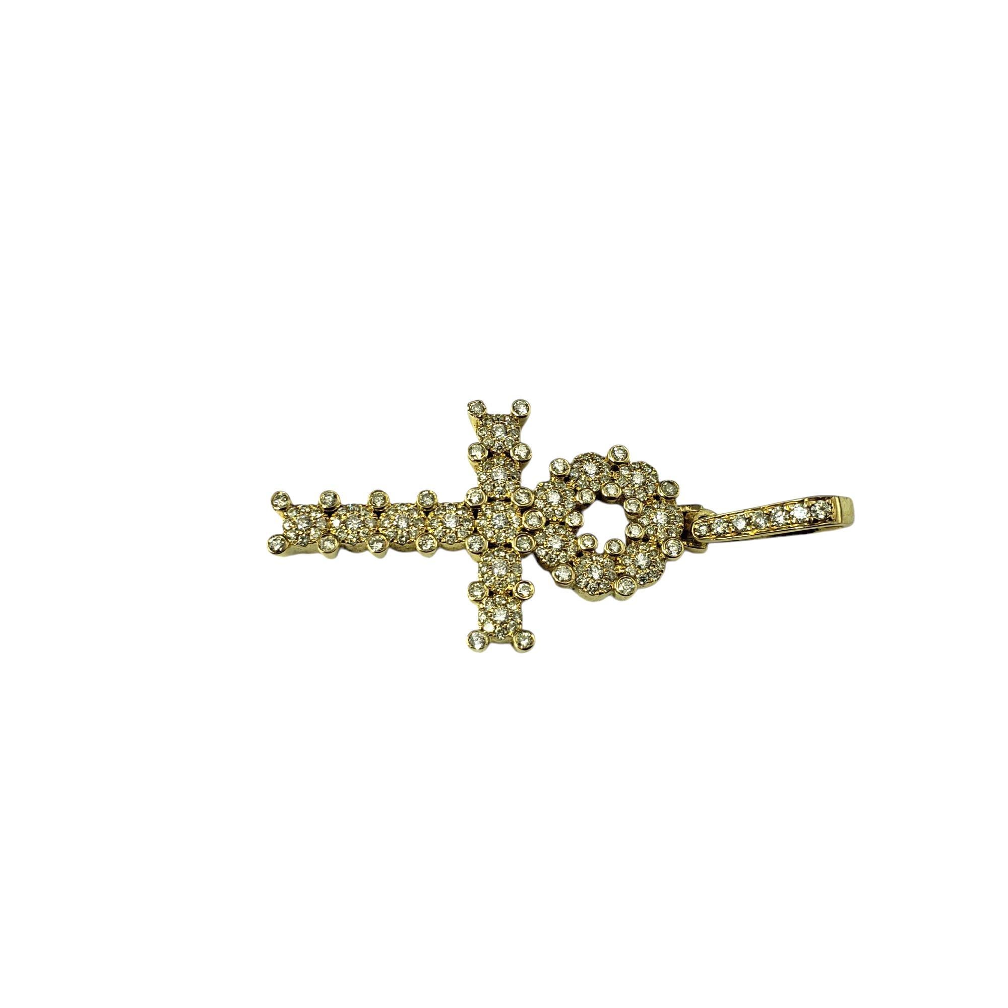 14 Karat Yellow Gold and Diamond Ankh Cross Pendant-

This 14K gold Ankh cross, an ancient Egyptian symbol representing life and immortality, is beautifully adorned with 178 sparkling round brilliant cut diamonds, adding a modern touch to its