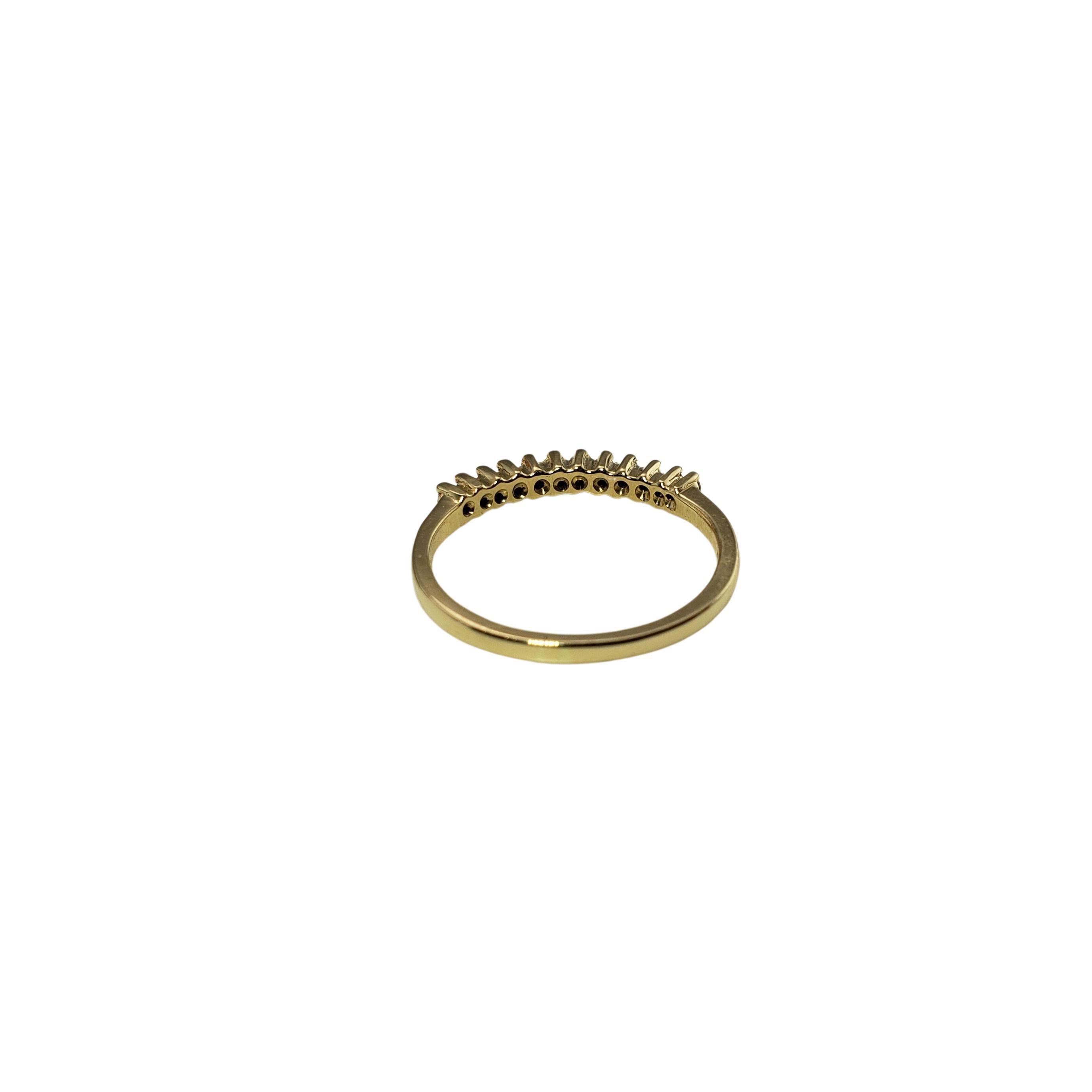 Vintage 14 Karat Yellow Gold and Diamond Band Ring Size 5.5-

This sparkling ring features 12 round brilliant cut diamonds set in classic 14K yellow gold. Width: 2 mm. Shank: 1 mm.

Approximate total diamond weight: .12 ct.

Diamond clarity: