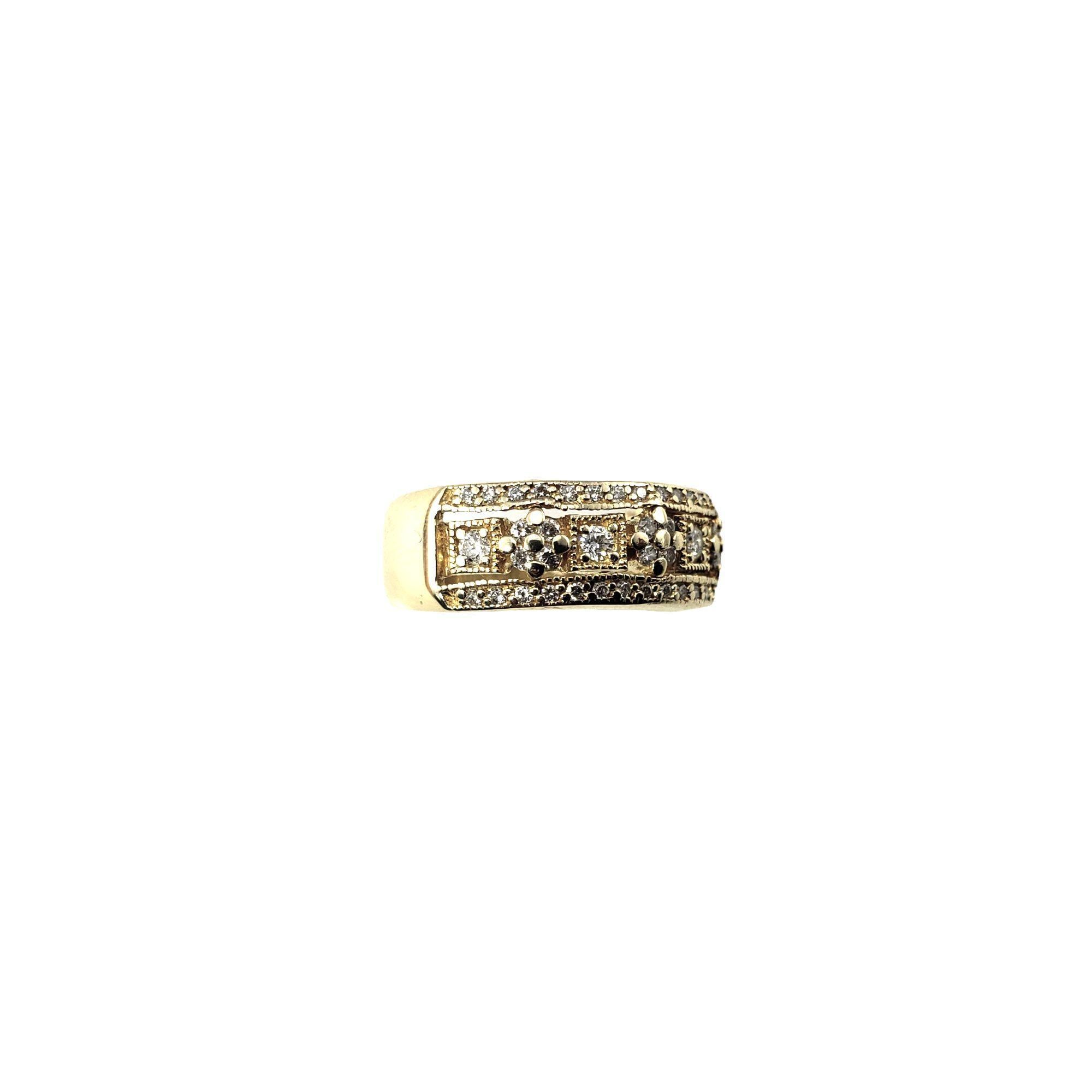14 Karat Yellow Gold and Diamond Band Ring Size 7-

This sparkling band features 48 round brilliant cut diamonds set in beautifully detailed 14K yellow gold. Width: 7 mm.

Inner inscription reads: 