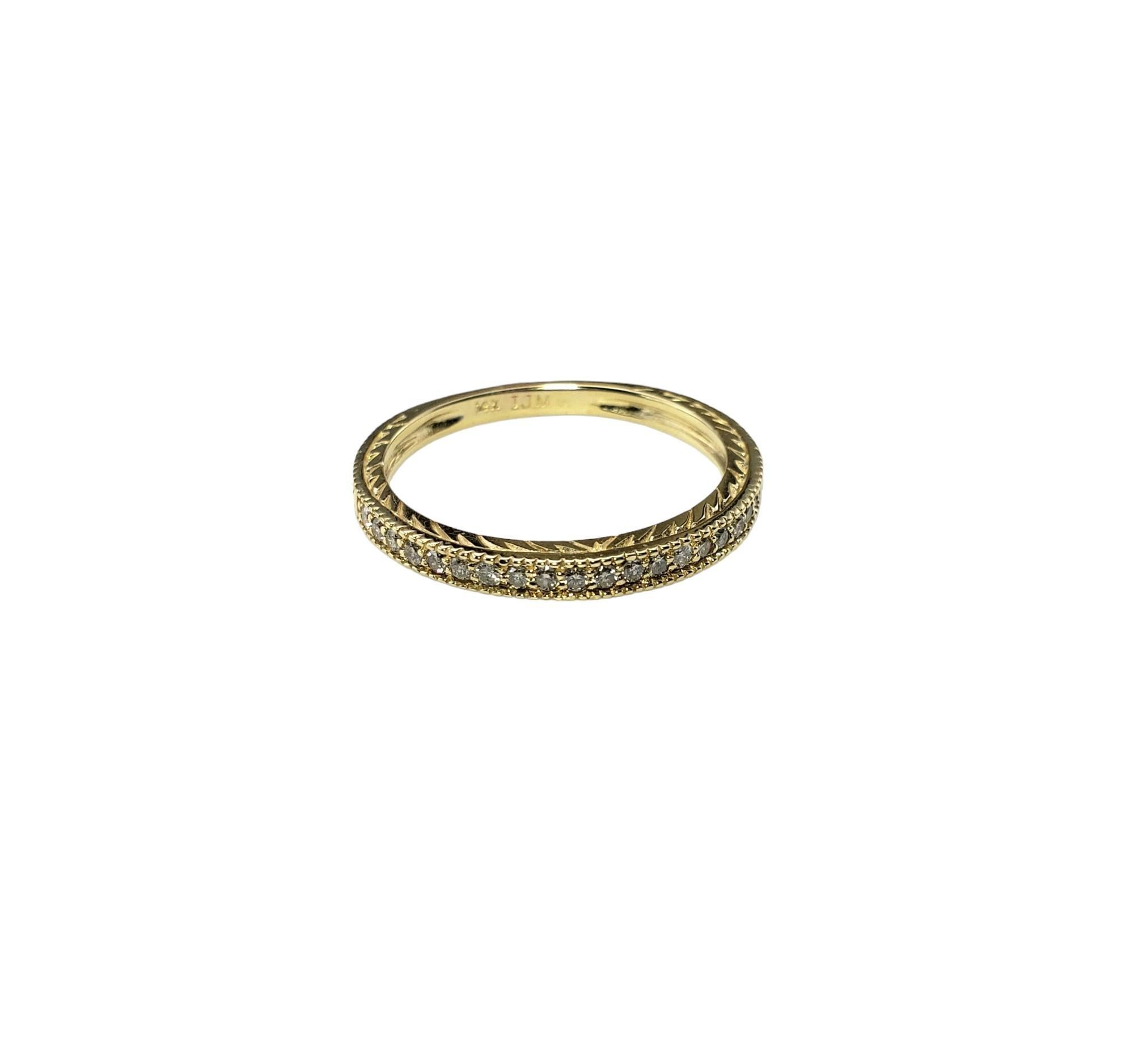 Vintage 14 Karat Yellow Gold and Diamond Band Ring Size 9-

This sparkling band features 20 round brilliant cut diamonds set in beautifully detailed 14K yellow gold. Width: 2 mm.

Approximate total diamond weight: .20 ct.

Diamond color: