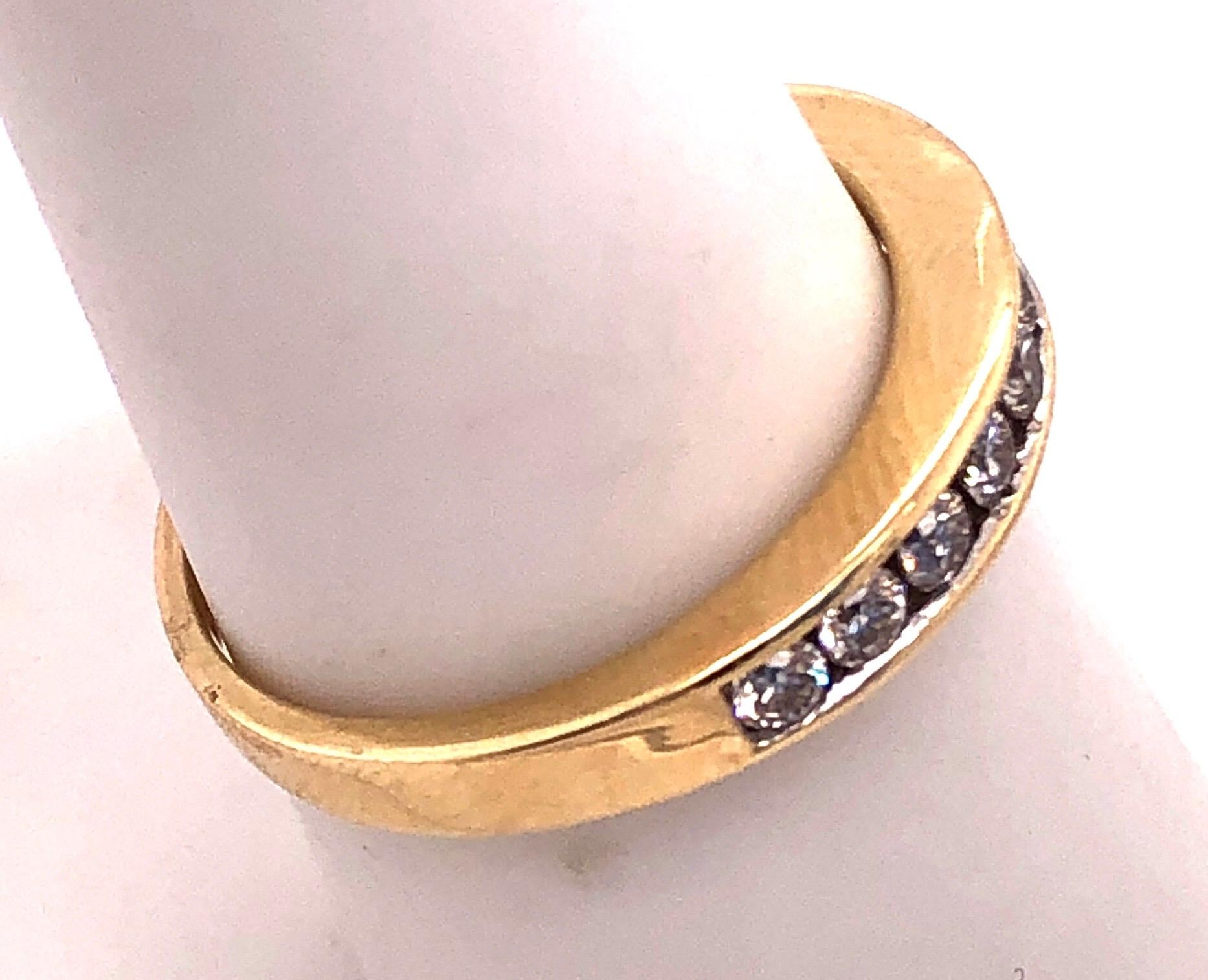 14 Karat Yellow Gold And Diamond Band Wedding Anniversary Ring 0.75 TDW.
Size 5.25
2.71 grams total weight.