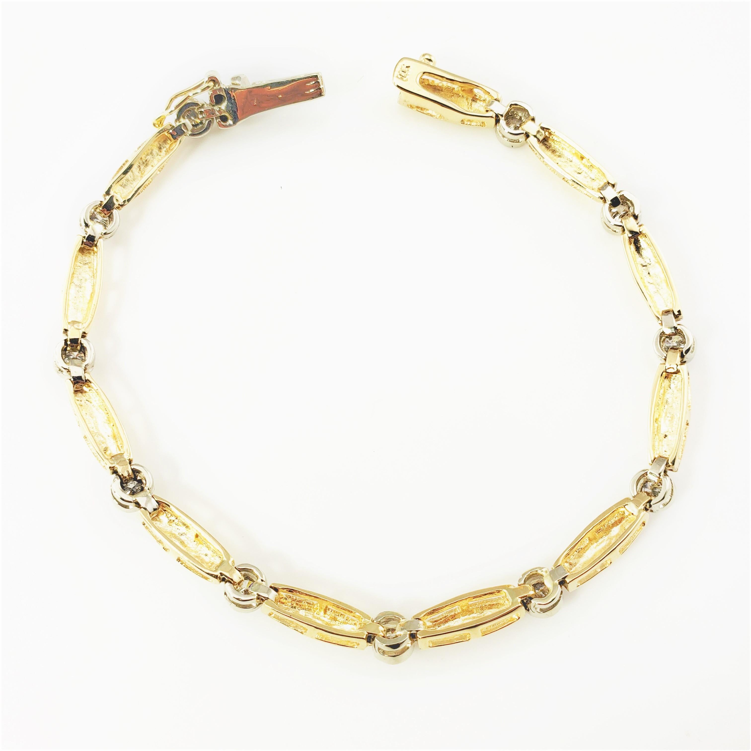 14 Karat Yellow Gold and Diamond Bracelet-

This sparkling bracelet features 11 round brilliant cut diamonds set in beautifully detailed 14K yellow gold.  Width:  4 mm.

Approximate total diamond weight:  1.10 ct.

Diamond color:  J

Diamond