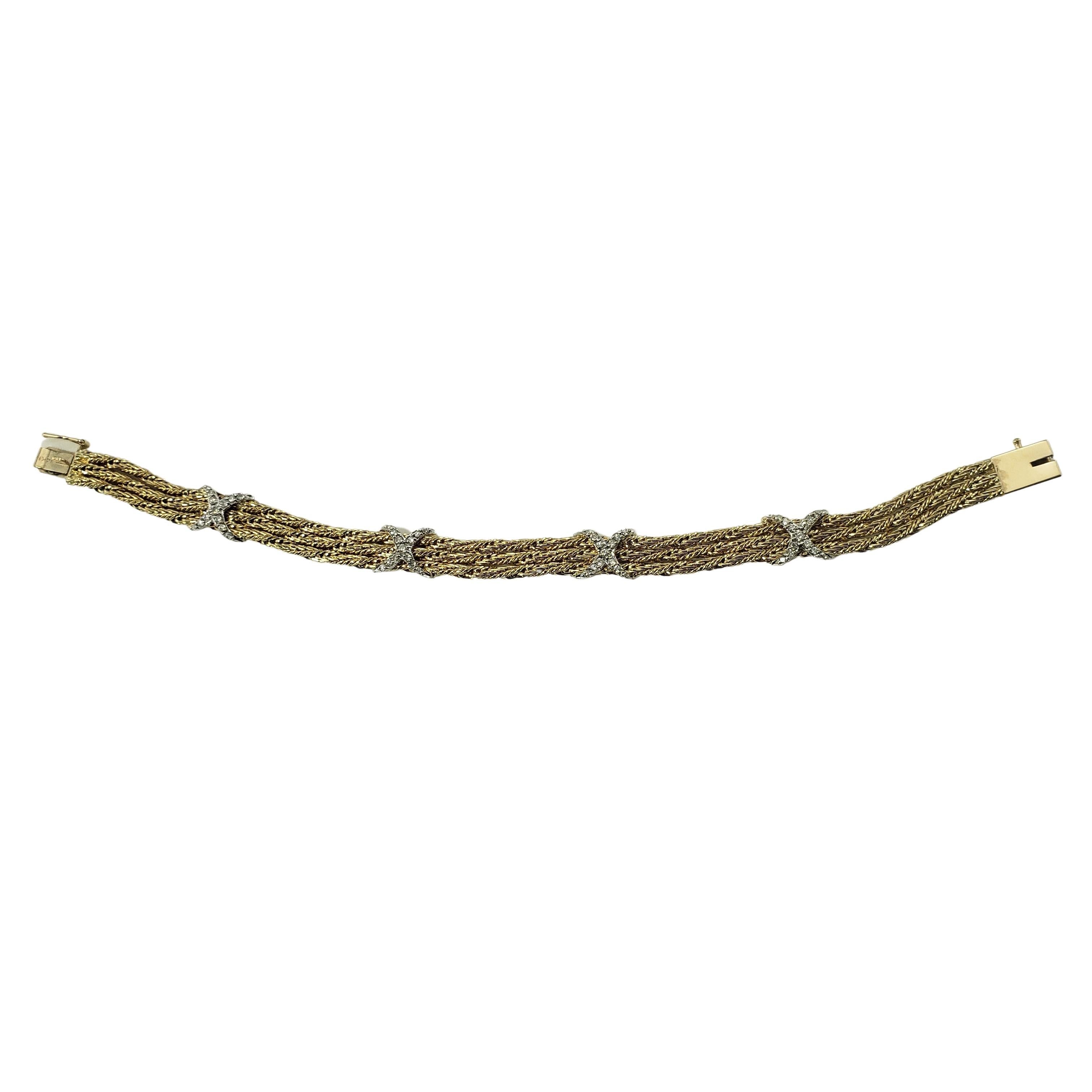 14 Karat Yellow Gold and Diamond Bracelet-

This lovely bracelet is decorated with 52 round brilliant cut diamonds set in beautifully detailed 14K yellow gold.  Width:  8 mm.

Approximate total diamond weight:  .48 ct.

Diamond color: H-K

Diamond