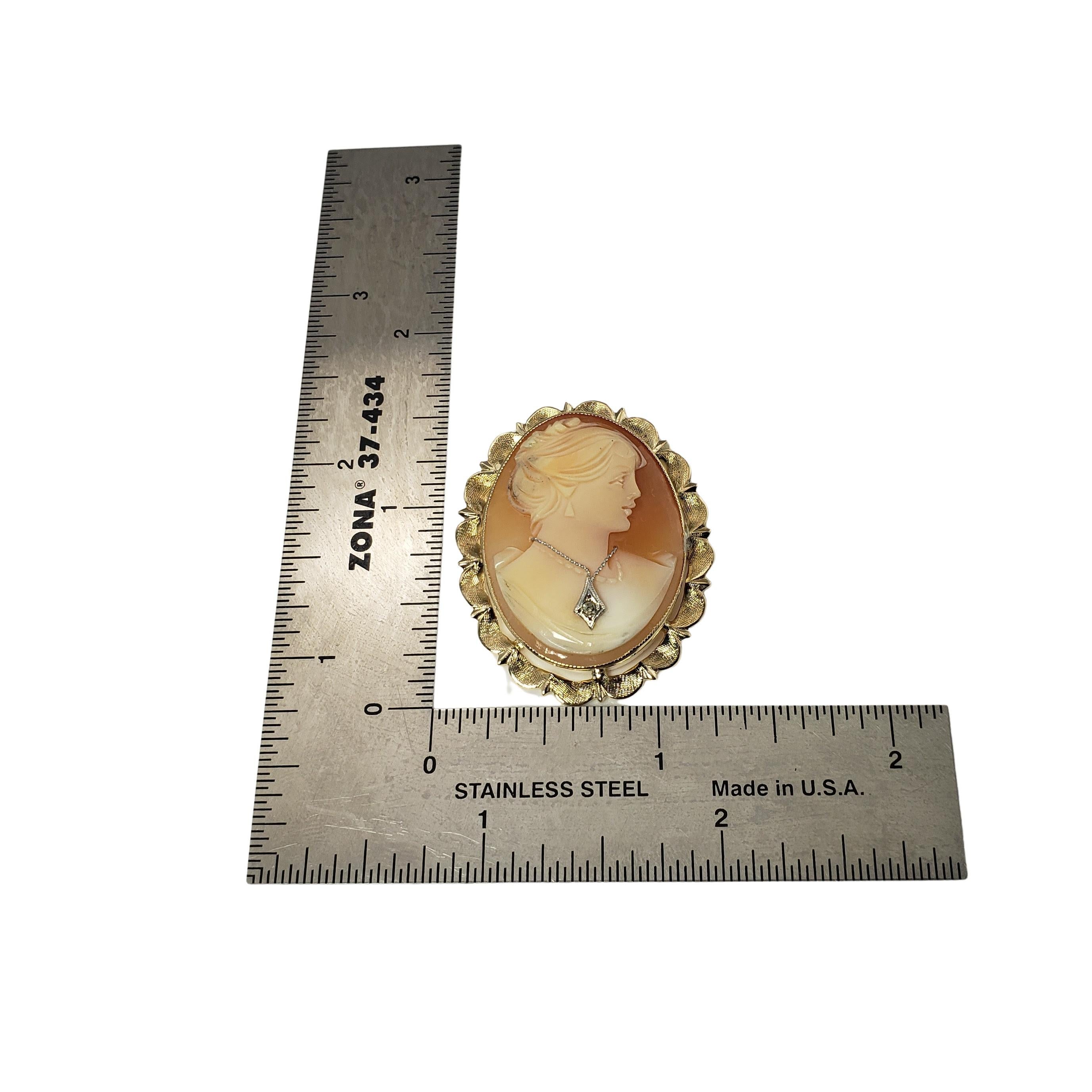 Vintage 14 Karat Yellow Gold and Diamond Cameo Brooch/Pendant-

This elegant brooch features a lovely lady in profile set beautifully detailed 14K gold. Can be worn as a brooch or a pendant. Accented with one round single cut diamond.

Approximate