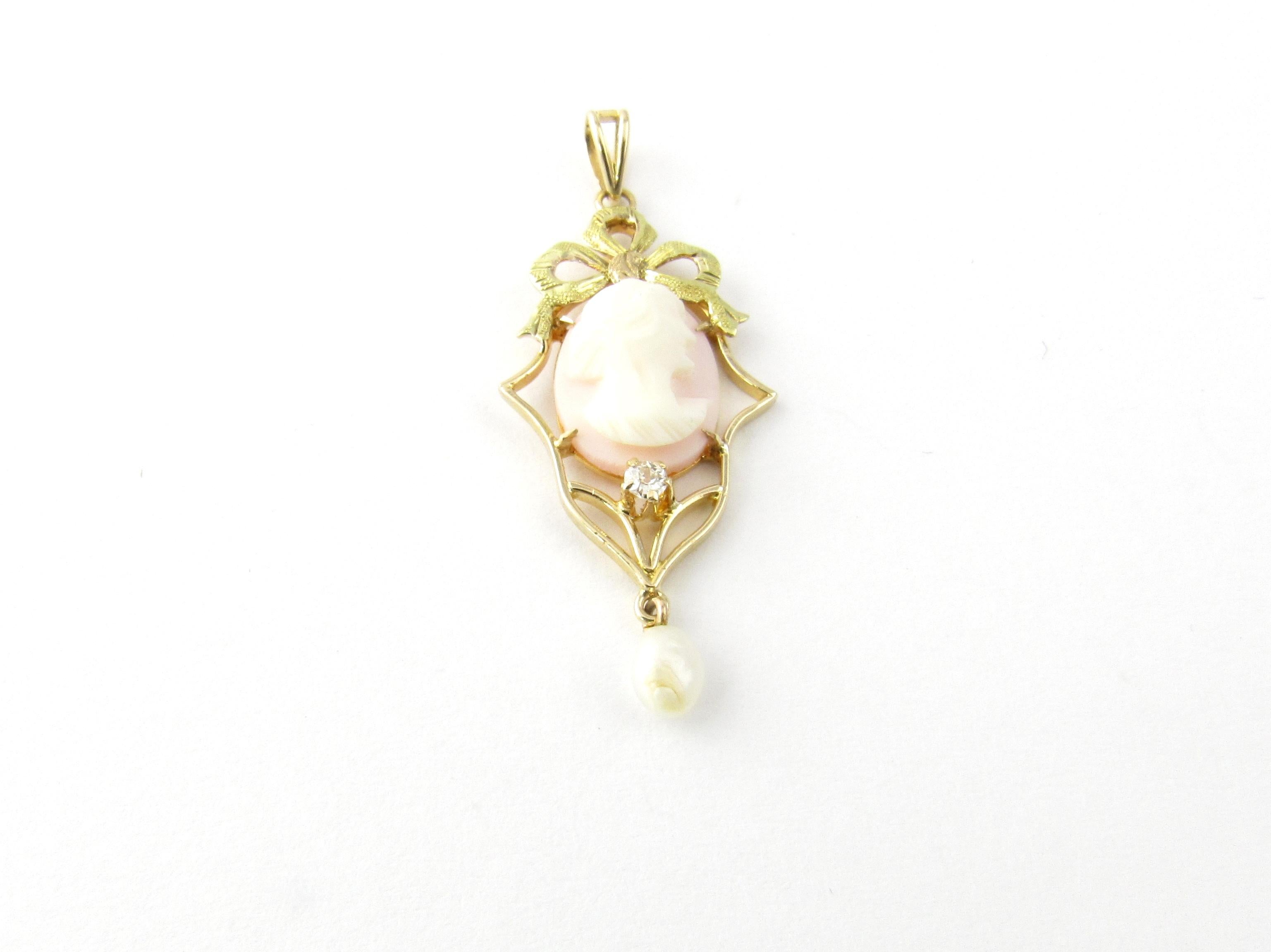 Vintage 14 Karat Yellow Gold and Diamond Cameo Pendant

This lovely cameo pendant is decorated with one round old mine cut diamond and one dangling freshwater pearl.

Approximate total diamond weight: .04 ct.

Diamond color: G

Diamond clarity: