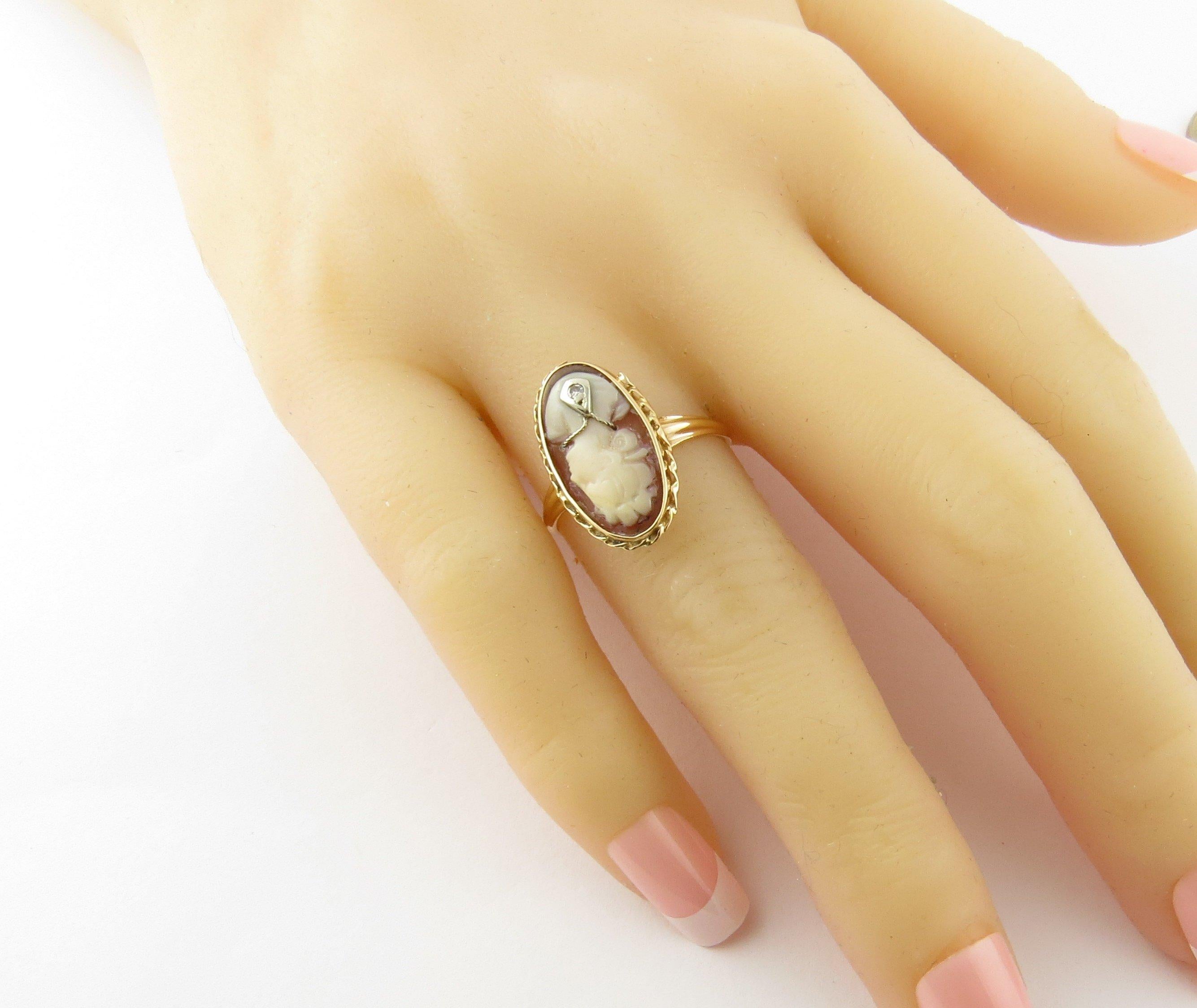Vintage 14 Karat Yellow Gold and Diamond Cameo Ring Size 7.25. This lovely cameo ring features a lovely lady in profile accented with one single cut diamond and framed in classic 14K yellow gold. 
Top of ring measures 19 mm x 11 mm. Shank measures 2