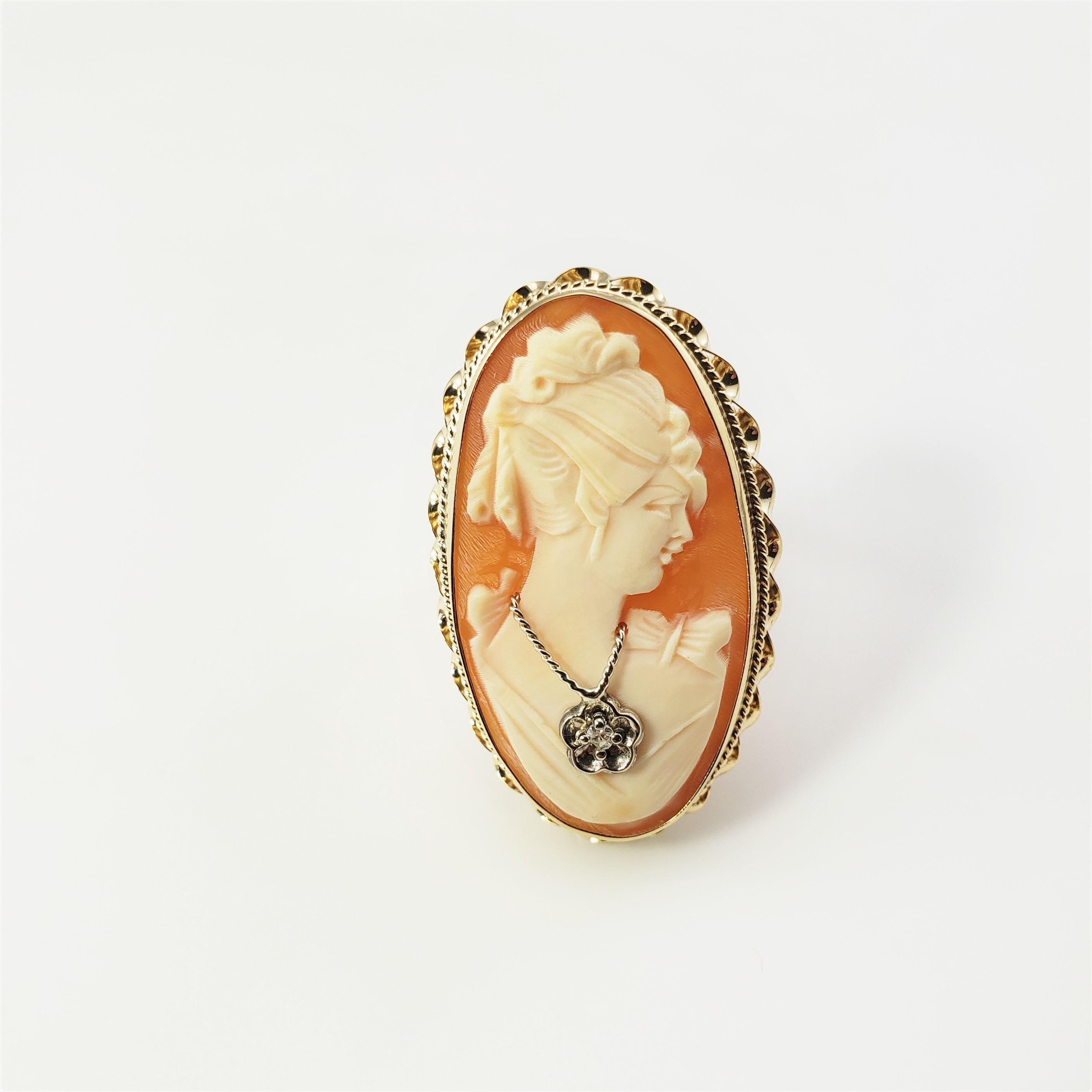 14 Karat Yellow Gold and Diamond Cameo Ring Size 8.75-

This lovely cameo ring features a lovely lady in profile accented with one round single cut diamond and set in classic 14K yellow gold. Top of ring measures 33 mm x 20 mm.  Shank measures 2.5