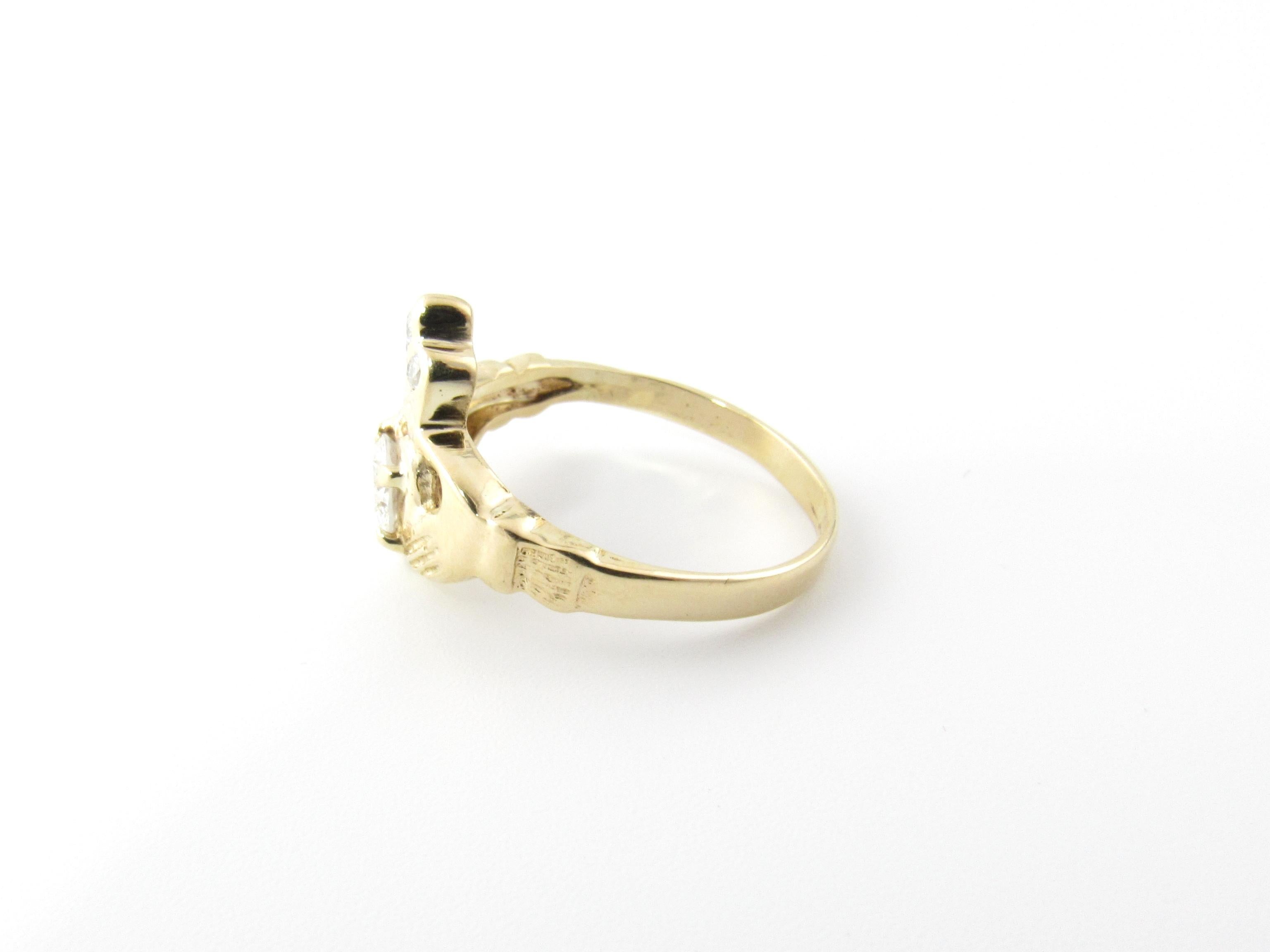 14 Karat Yellow Gold and Diamond Claddagh Ring Size 6.25-

The traditional Irish Claddagh is a symbol of friendship, love and loyalty.  Crafted in classic 14K yellow gold and decorated with one round brilliant cut diamond (.40 ct.) and three round