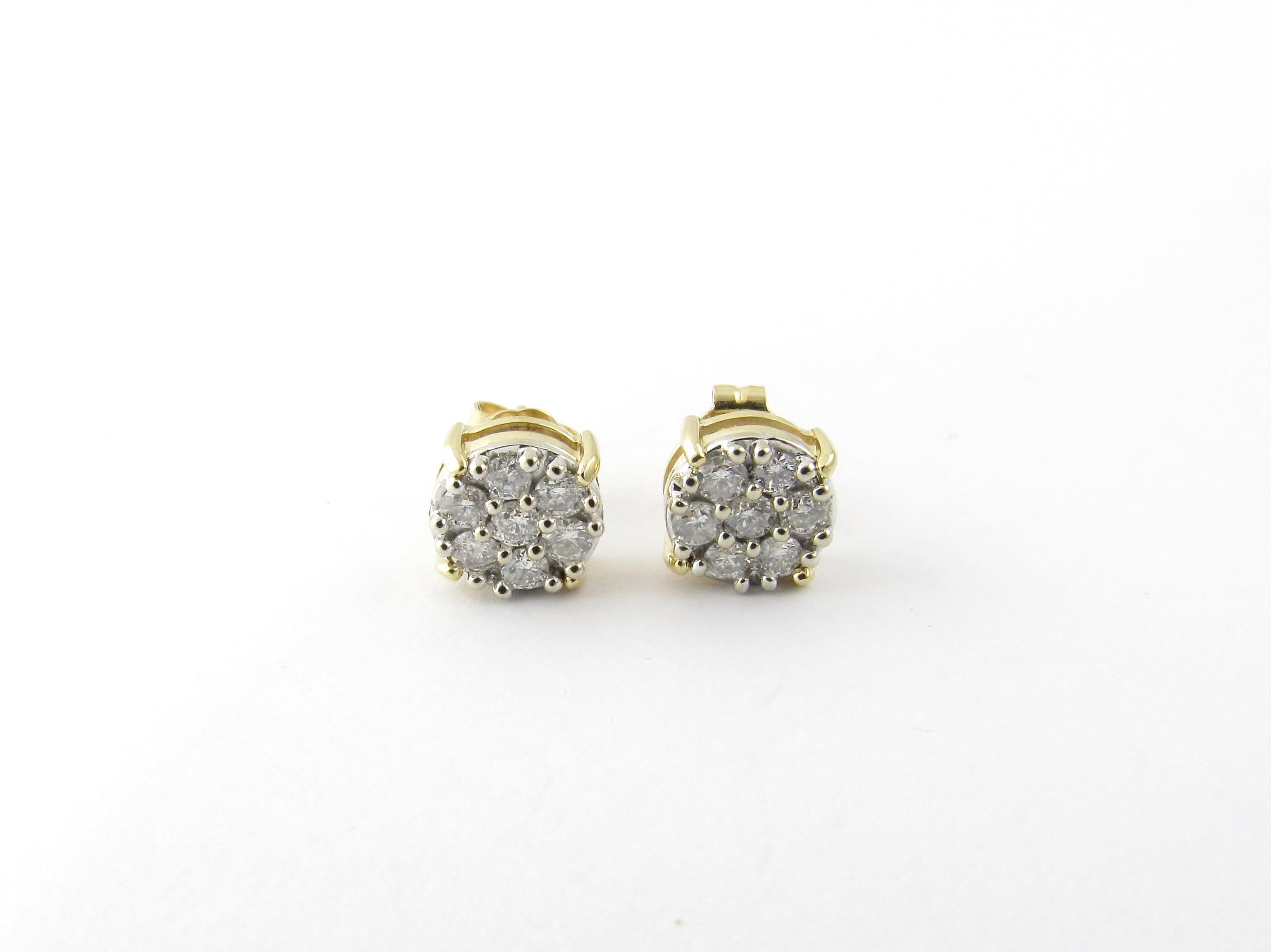 14 Karat Yellow Gold and Diamond Cluster Earrings-

These sparkling earrings each features seven round brilliant cut diamonds set in classic 14K yellow gold.  Push back closures.

Approximate total diamond weight:  .44 ct.

Diamond color: 