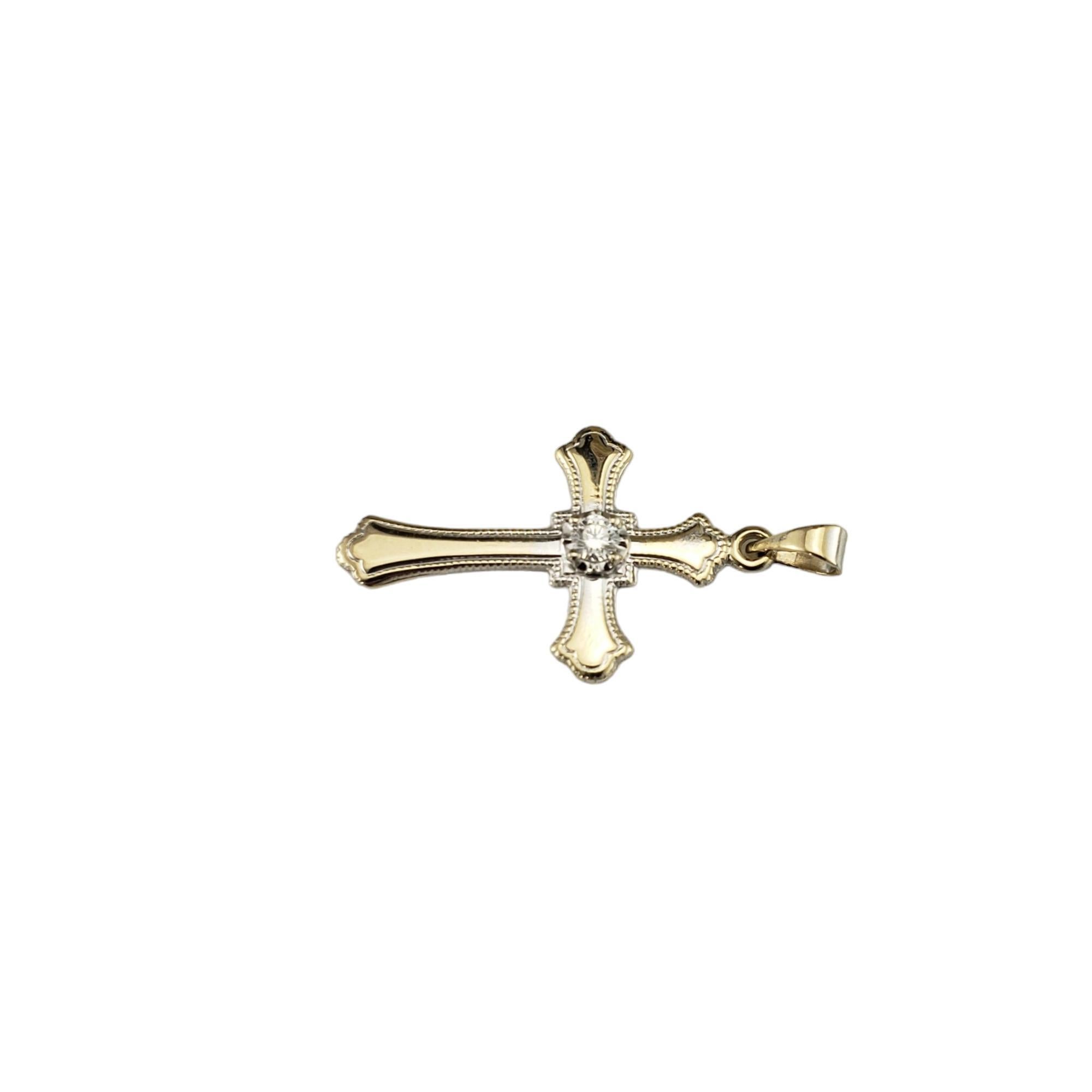 14 Karat Yellow Gold and Diamond Cross Pendant

This elegant cross pendant features one round brilliant cut diamond set in classic 14K yellow gold.

Approximate total diamond weight: .06 ct.

Diamond color: G

Diamond clarity: VS2

Size:  24 mmx 15