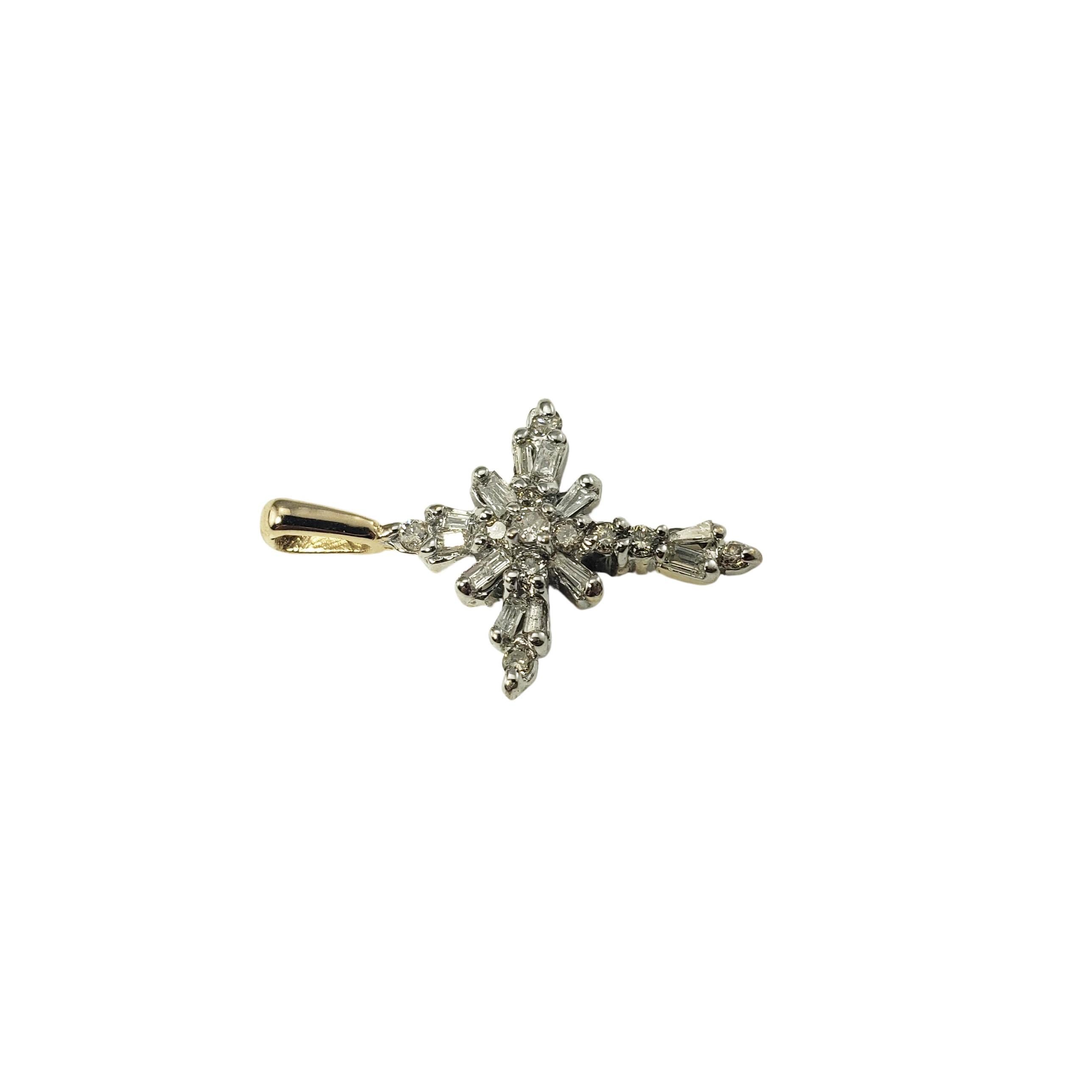 14 Karat Yellow Gold and Diamond Cross Pendant-

This sparkling cross pendant features 12 baguette diamonds and 11 round brilliant cut diamonds set in classic 14K yellow gold.

Approximate total diamond weight:   .40 ct.

Diamond color: 