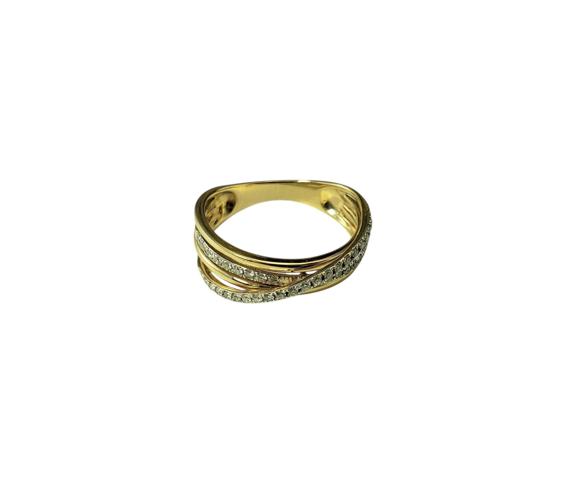 14 Karat Yellow Gold and Diamond Crossover Band Ring Size 6.25

This elegant crossover band features 40 round brilliant cut diamonds set in beautifully detailed 14K yellow gold. Width: 6 mm. Shank: 3 mm.

Approximate total diamond weight: .30