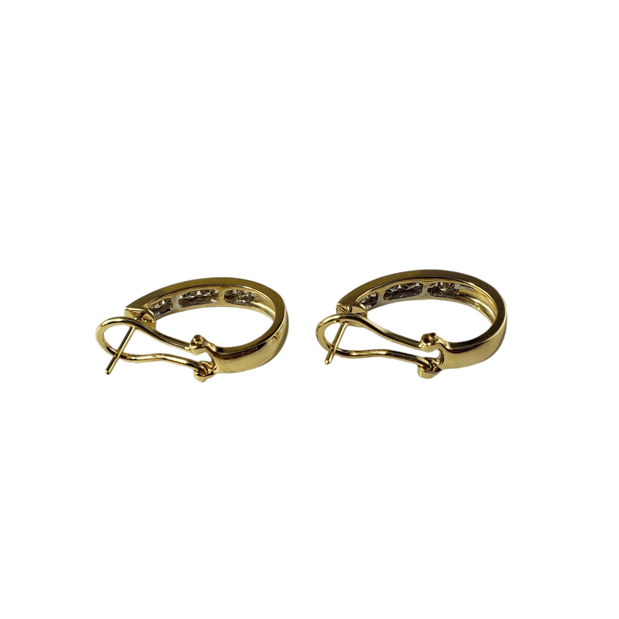 Vintage 14 Karat Yellow Gold and Diamond Cuff Earrings-

These sparkling earrings each feature six round brilliant cut diamonds set in classic 14K yellow gold. Omega back closures.

Approximate total diamond weight: .50 ct.

Diamond color: