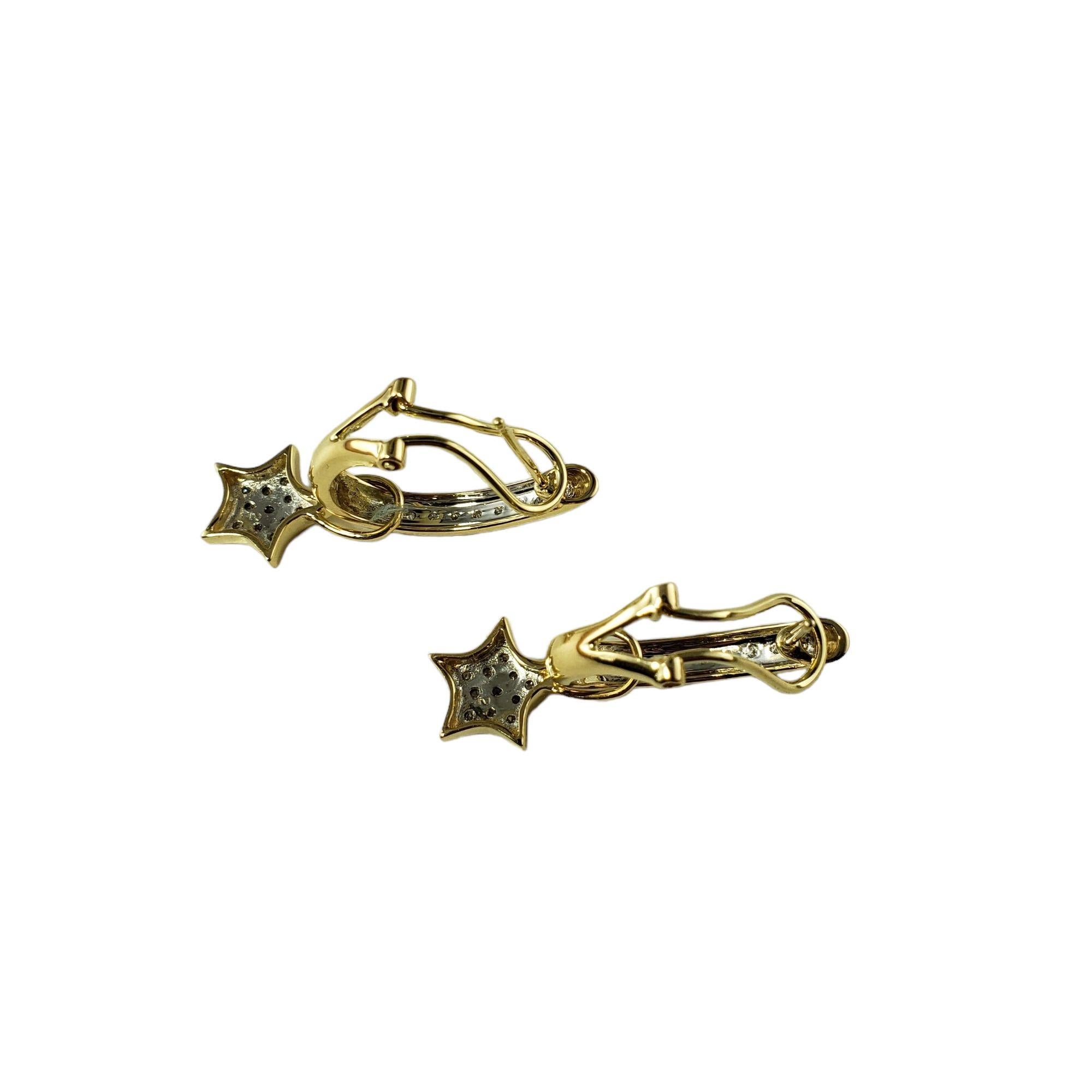Vintage 14 Karat Yellow Gold and Diamond Cuff Star Earrings-

These lovely cuff earrings feature a dangling star and each are accented with 20 round brilliant cut diamonds set in 14K yellow gold. Omega back closures.

Approximate total diamond