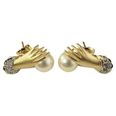 14 Karat Yellow Gold and Diamond Cuffed Hand Holding Pearl Stud Earrings #19527