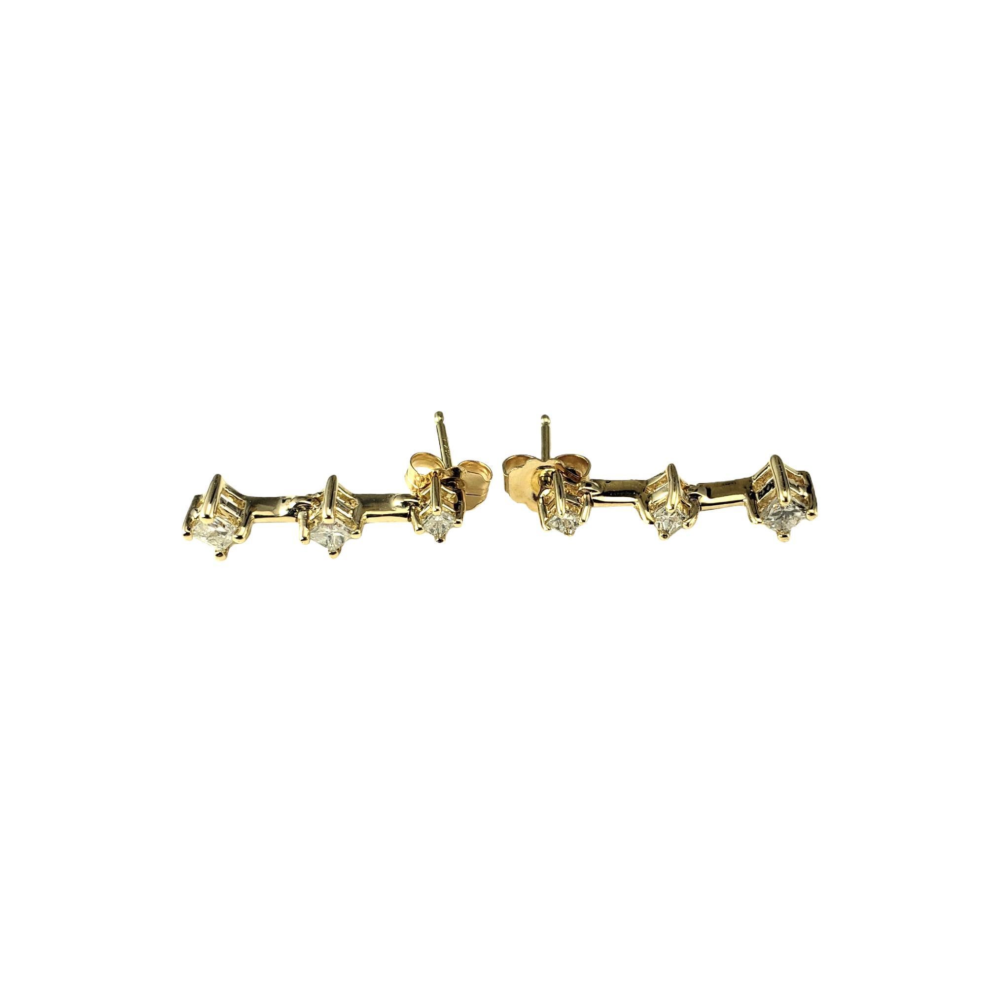 14 Karat Yellow Gold and Diamond Earrings

These sparkling earrings each feature three princess cut diamonds set in classic 14K yellow gold.  Push back closures.

Approximate total diamond weight: .16 ct.

Diamond color: I-J

Diamond clarity:
